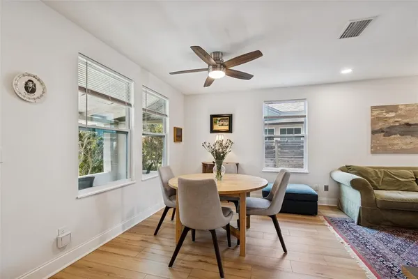 a living room with furniture cabinets and a book shelf