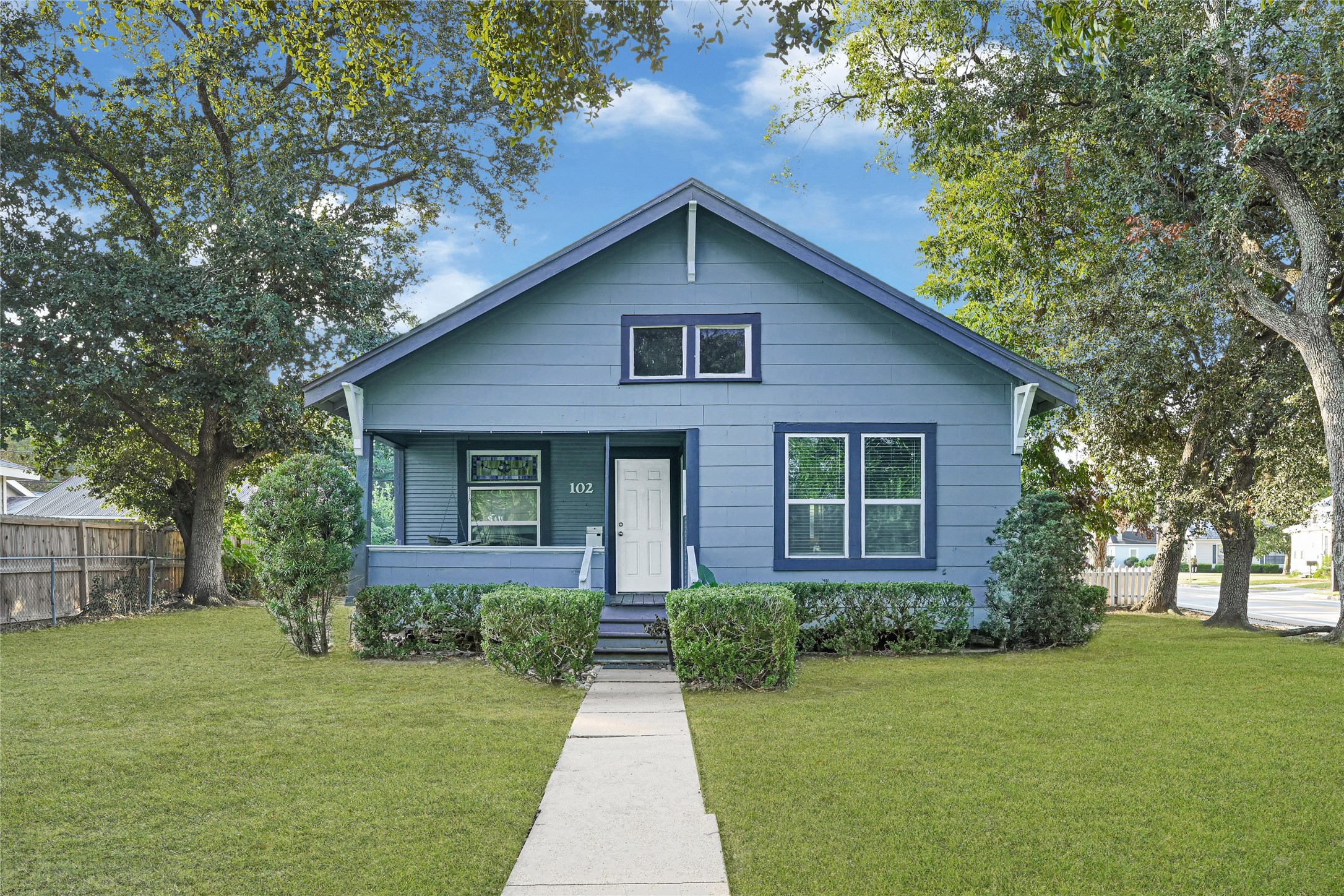 102 4th Street Sugar Land, TX 77498 - Photo 1 of 50 a front view of a house with a yard