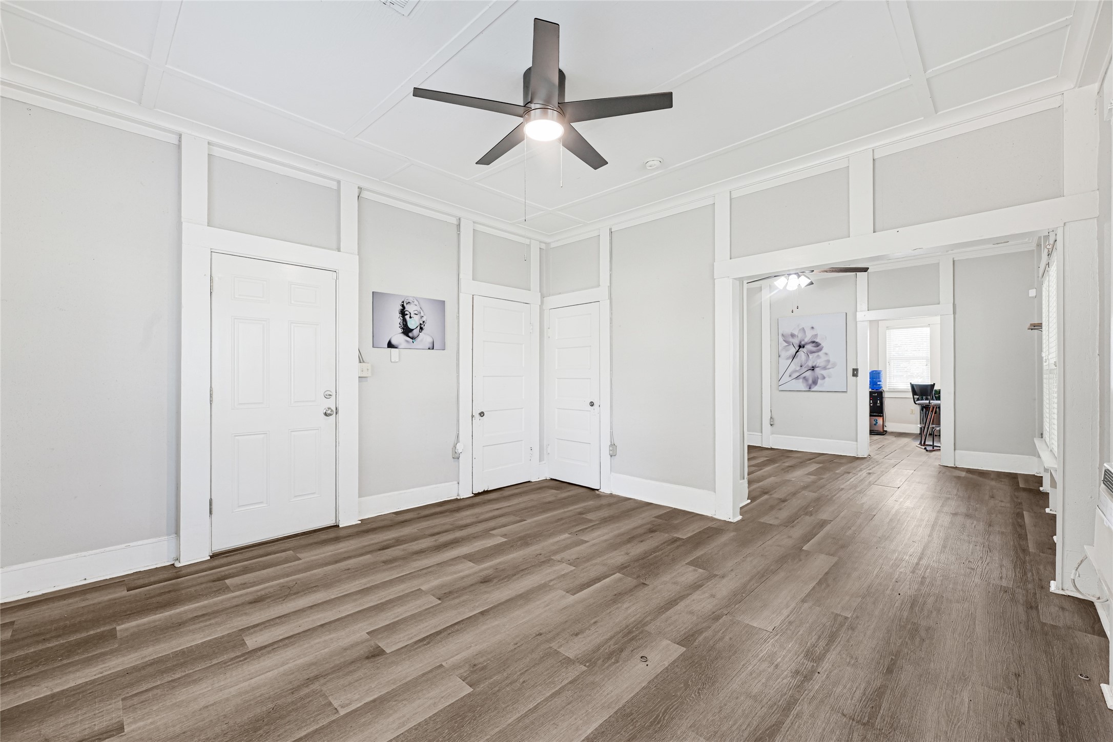 102 4th Street Sugar Land, TX 77498 - Photo 15 of 50 a view of a livingroom with wooden floor and a ceiling fan