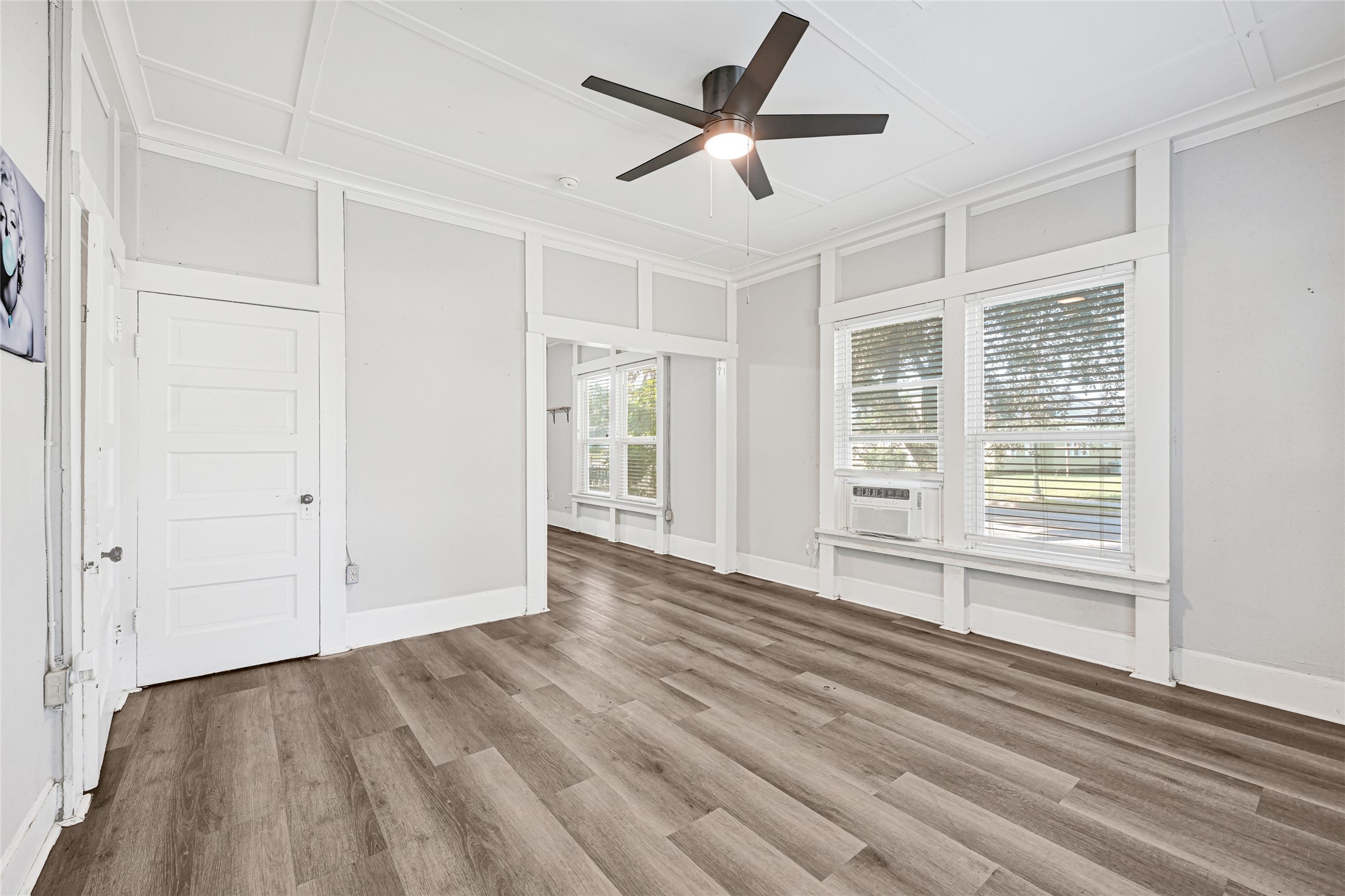 102 4th Street Sugar Land, TX 77498 - Photo 17 of 50 an empty room with wooden floor and windows