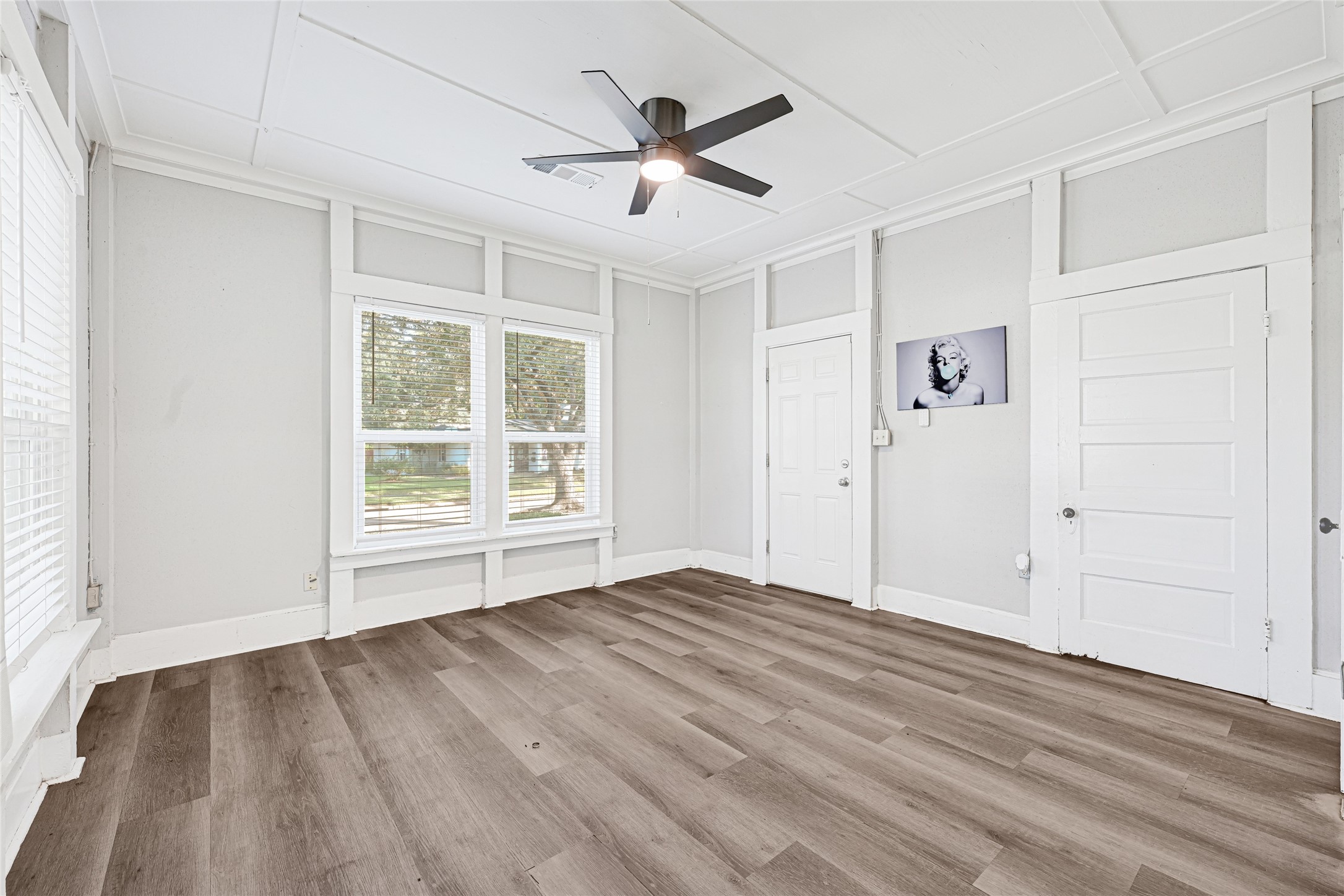 102 4th Street Sugar Land, TX 77498 - Photo 18 of 50 wooden floor in an empty room with a window
