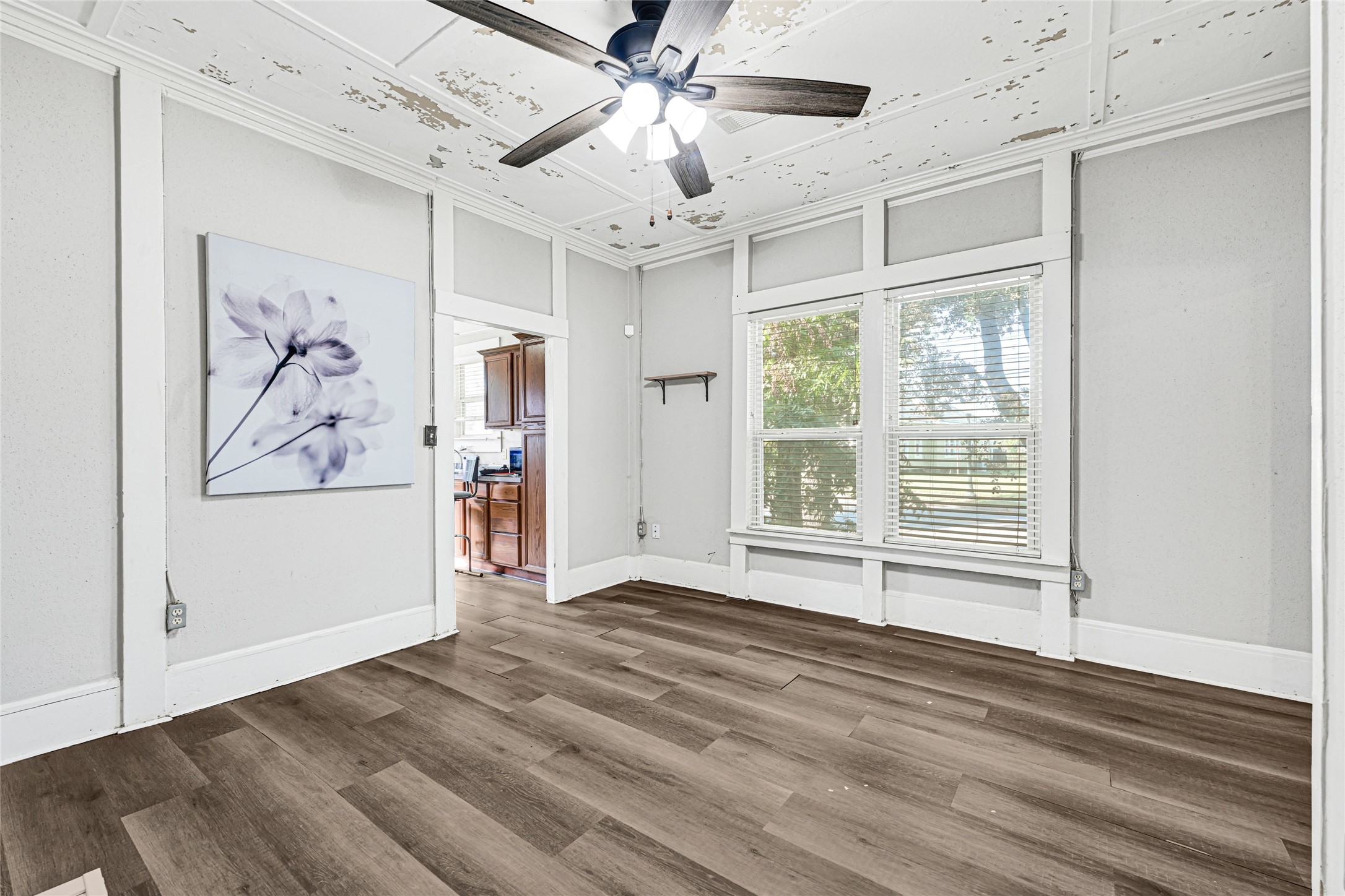 102 4th Street Sugar Land, TX 77498 - Photo 2 of 50 a view of empty room with wooden floor and fan