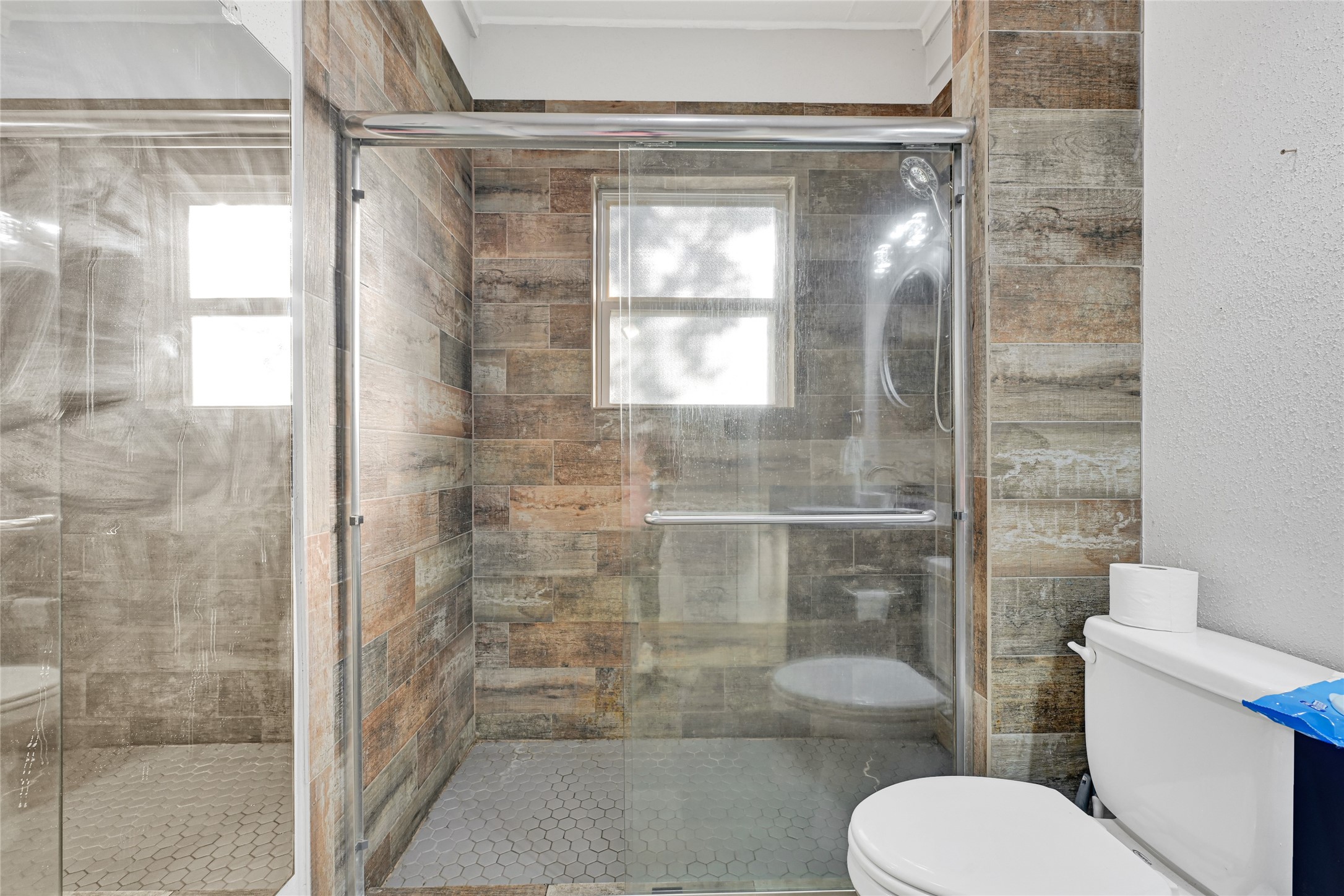 102 4th Street Sugar Land, TX 77498 - Photo 26 of 50 a bathroom with a toilet and a shower