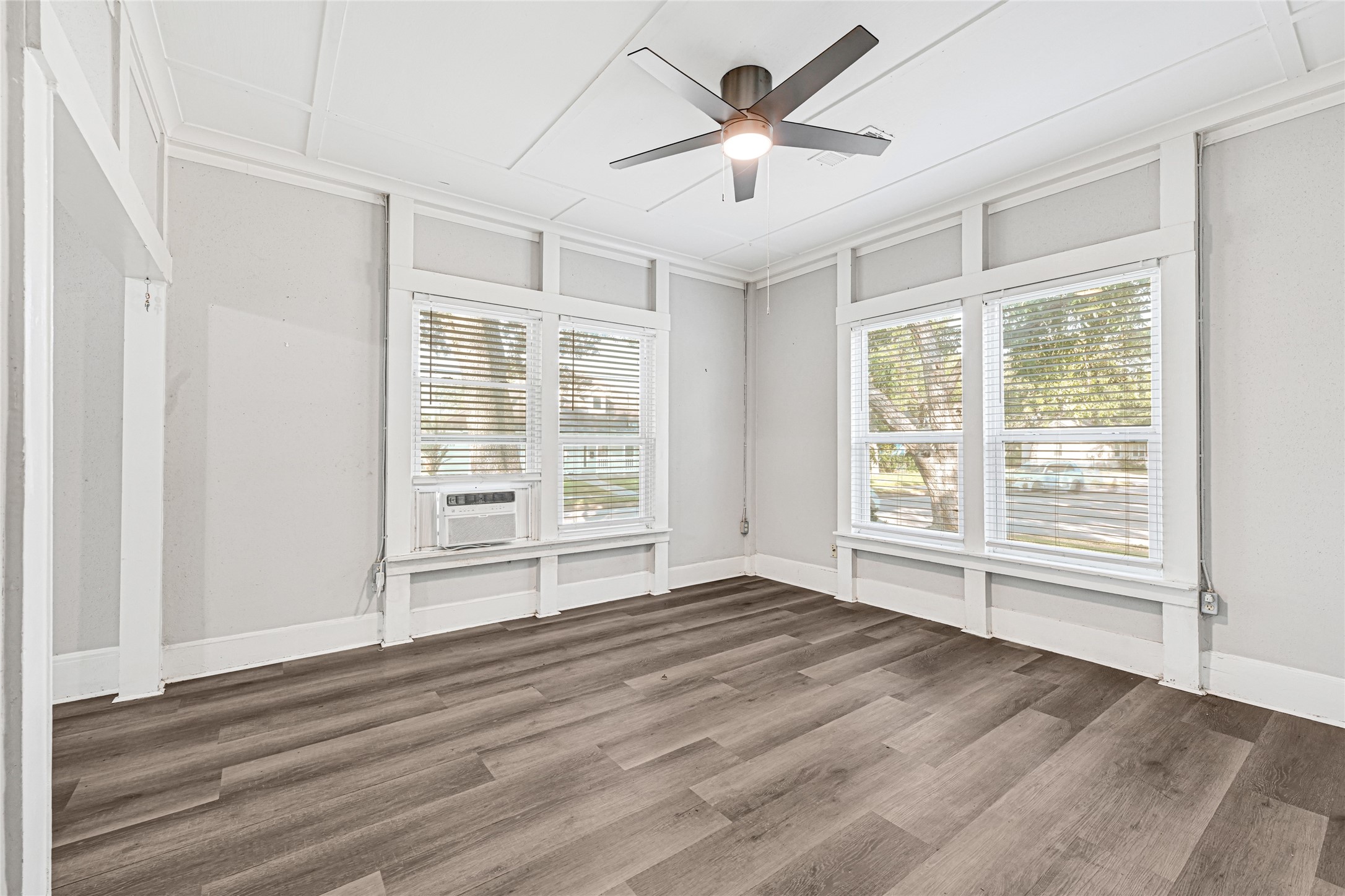 102 4th Street Sugar Land, TX 77498 - Photo 3 of 50 an empty room with wooden floor and windows