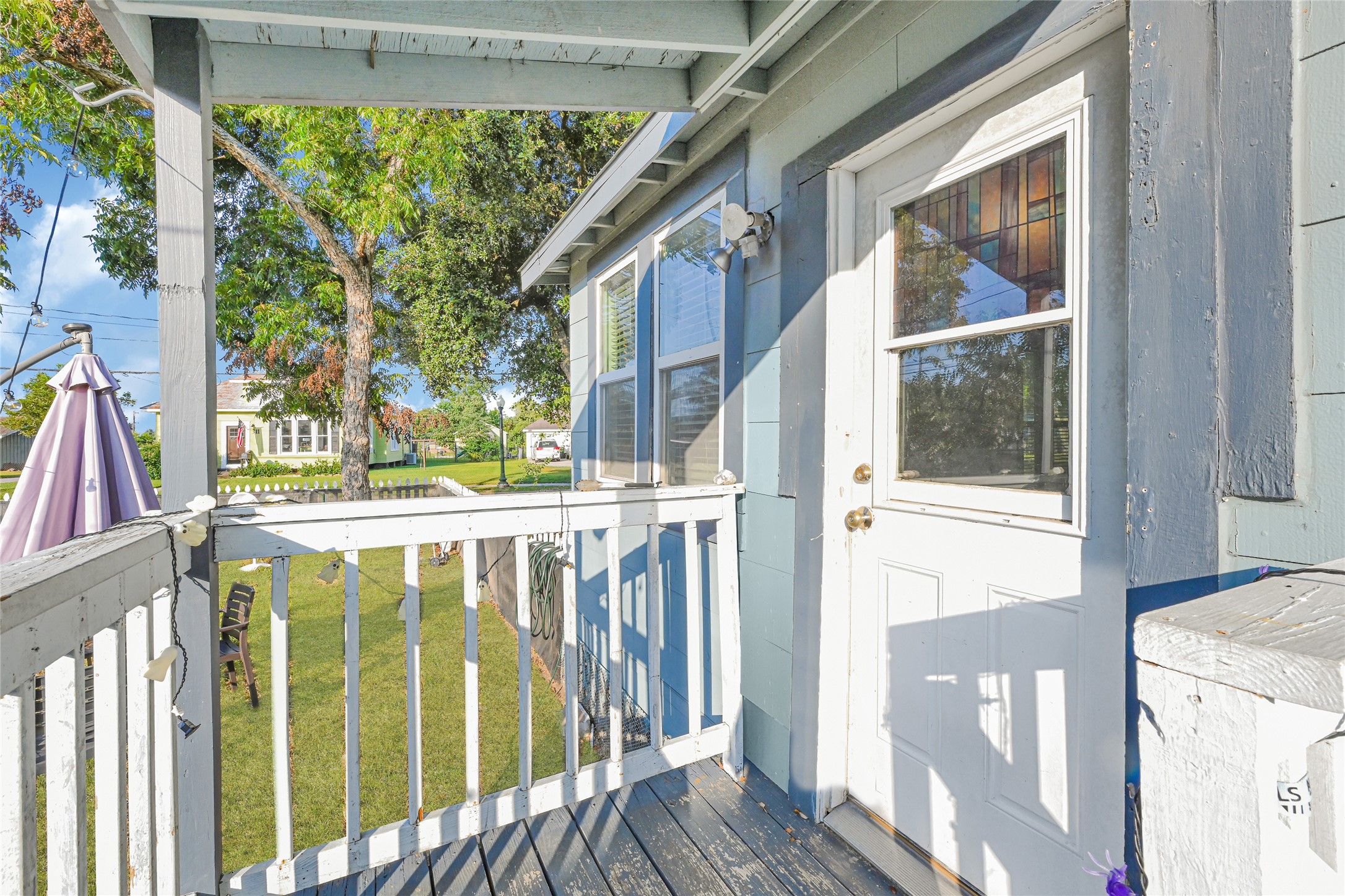 102 4th Street Sugar Land, TX 77498 - Photo 34 of 50 a view of a balcony with wooden floor