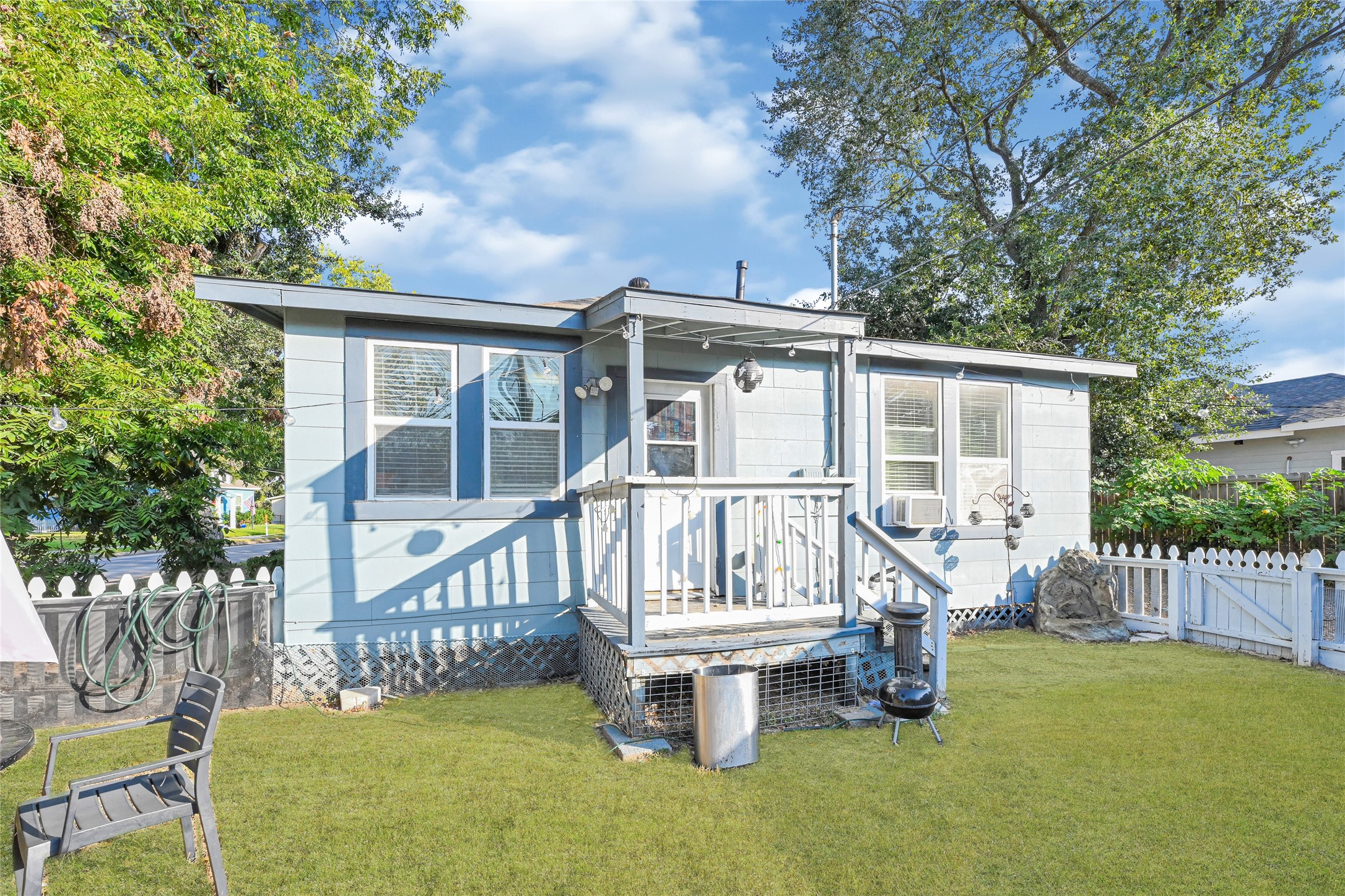 102 4th Street Sugar Land, TX 77498 - Photo 38 of 50 a view of a house with a wooden deck and a yard