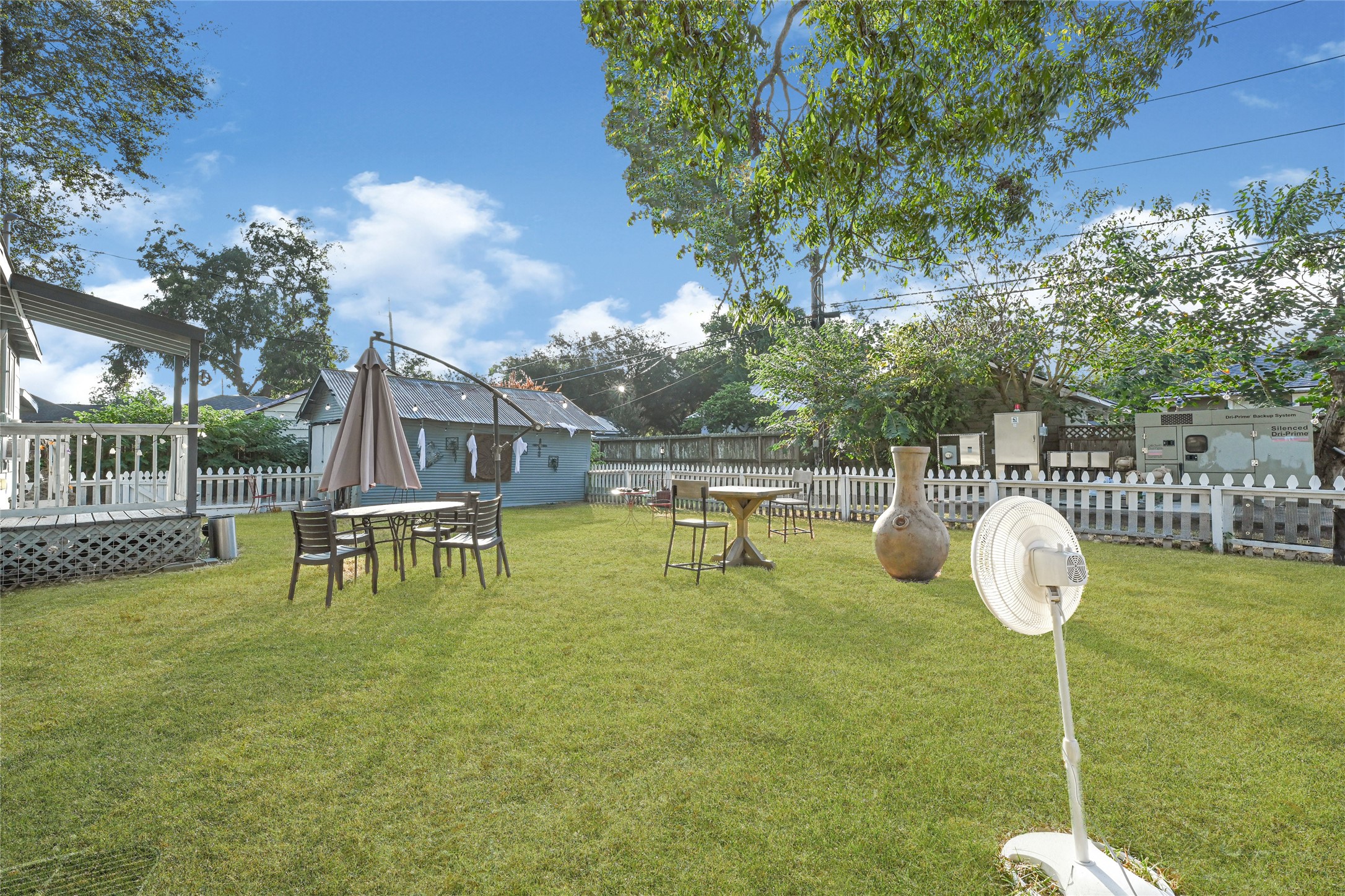 102 4th Street Sugar Land, TX 77498 - Photo 39 of 50 a backyard of a house with table and chairs