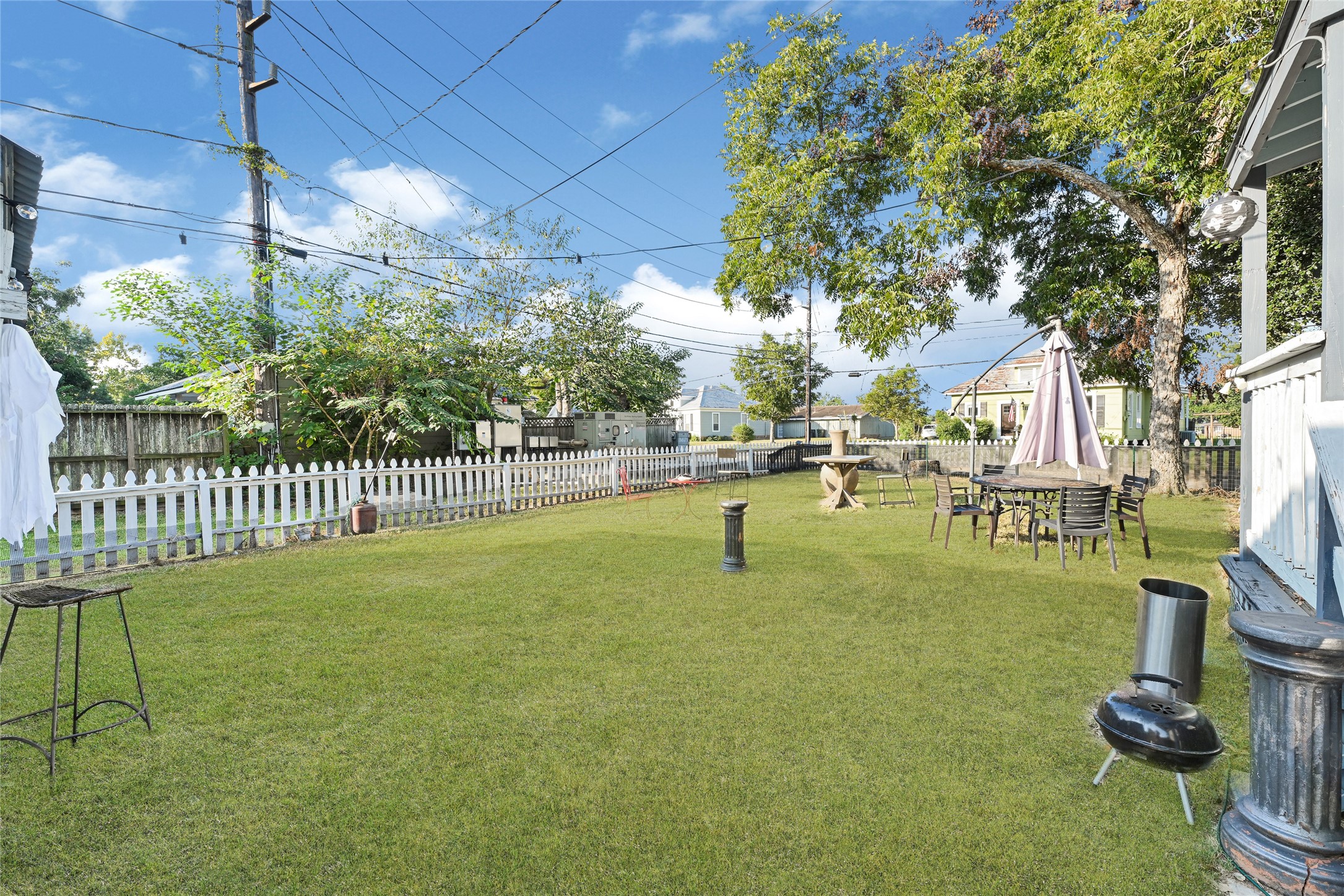102 4th Street Sugar Land, TX 77498 - Photo 42 of 50 a swimming pool with lots of tress in front of it