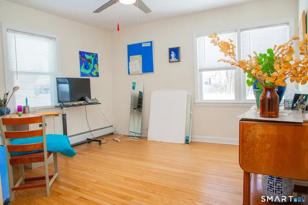 a workspace with furniture and window