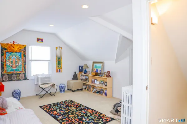 a room with furniture a couch and a window