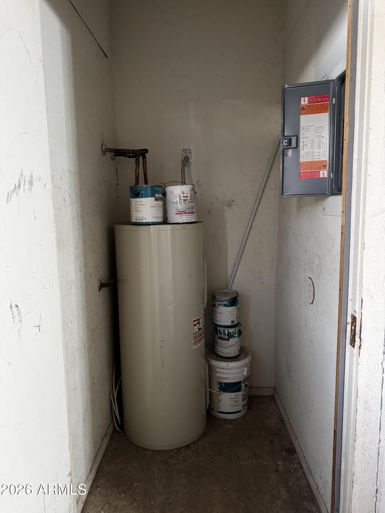 12123 West Bell Road, Unit 258 Surprise, AZ 85378 - Photo 18 of 30 a room with water heater and white walls