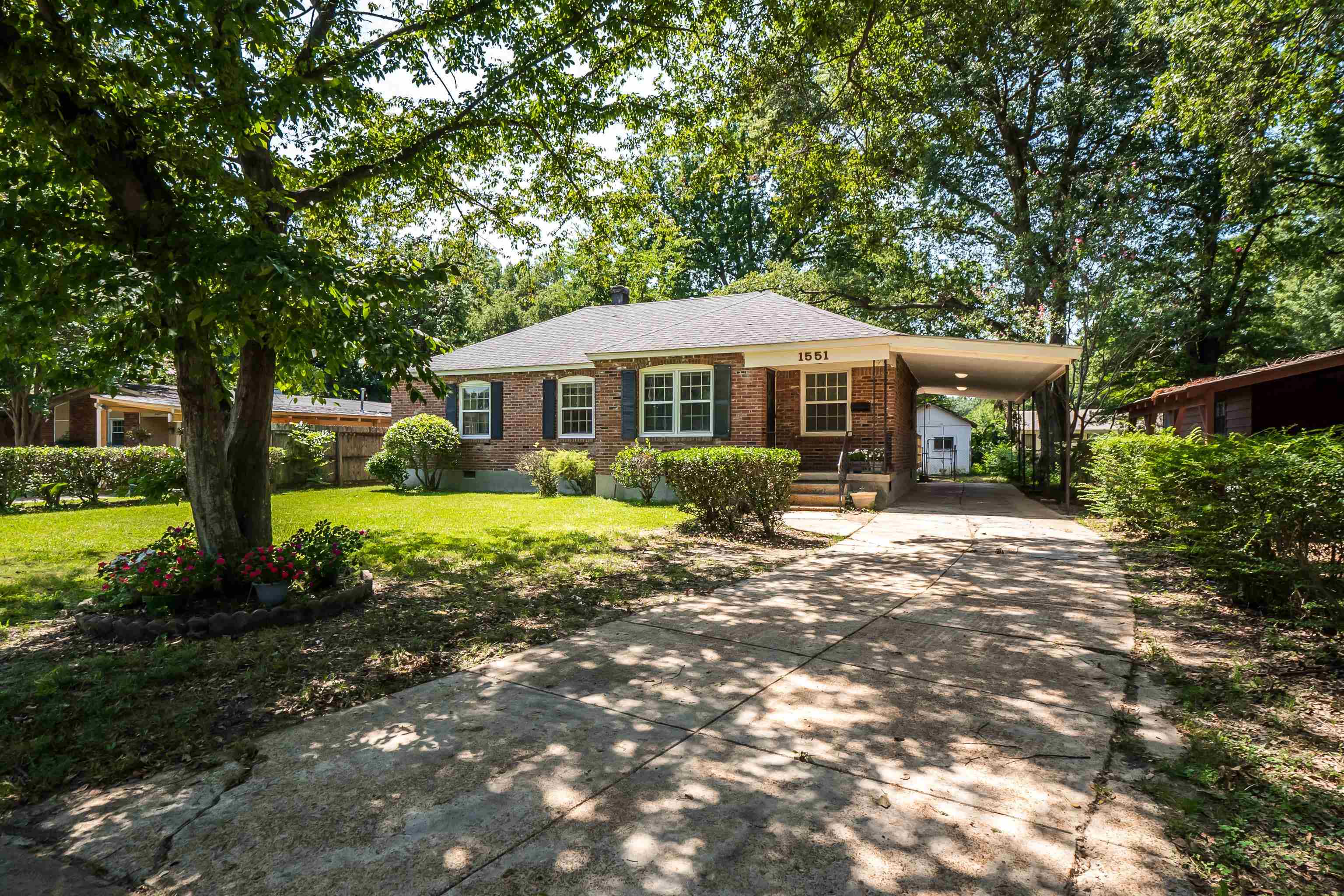 1551 Delmont Road Memphis, TN 38117 - Photo 1 of 25 a front view of a house with a yard