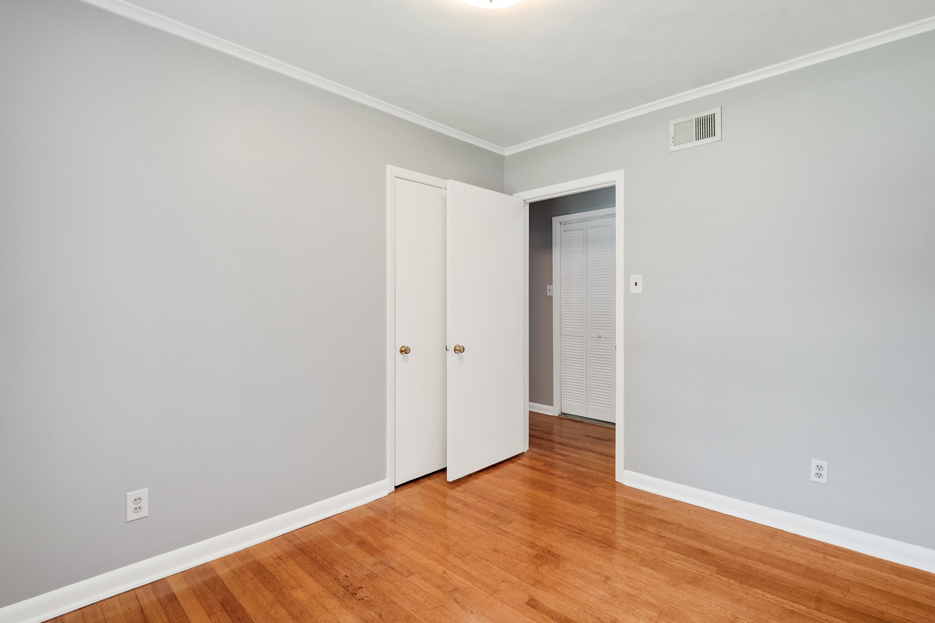 1551 Delmont Road Memphis, TN 38117 - Photo 16 of 25 a view of an empty room with wooden floor