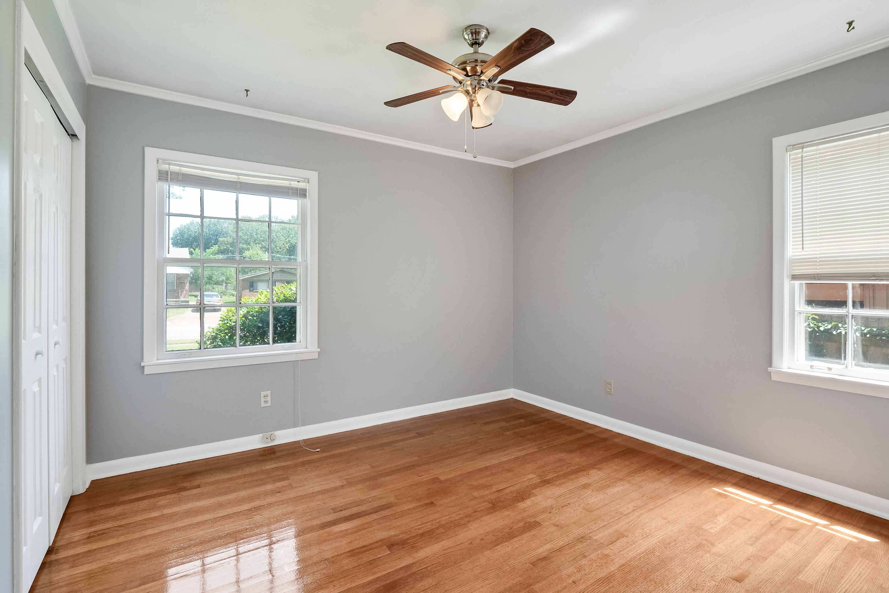 1551 Delmont Road Memphis, TN 38117 - Photo 17 of 25 a view of a big room with wooden floor and a window
