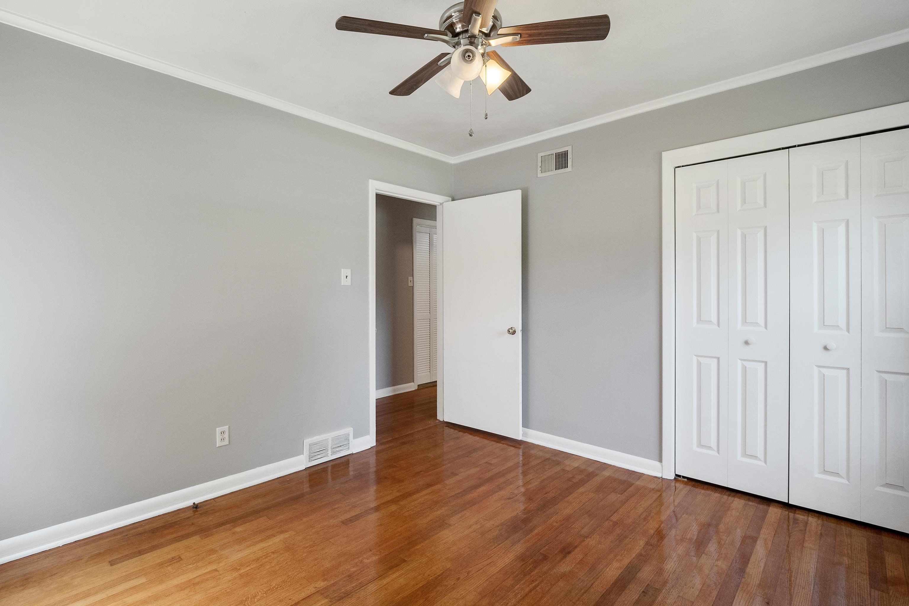 1551 Delmont Road Memphis, TN 38117 - Photo 18 of 25 a view of an empty room and wooden floor