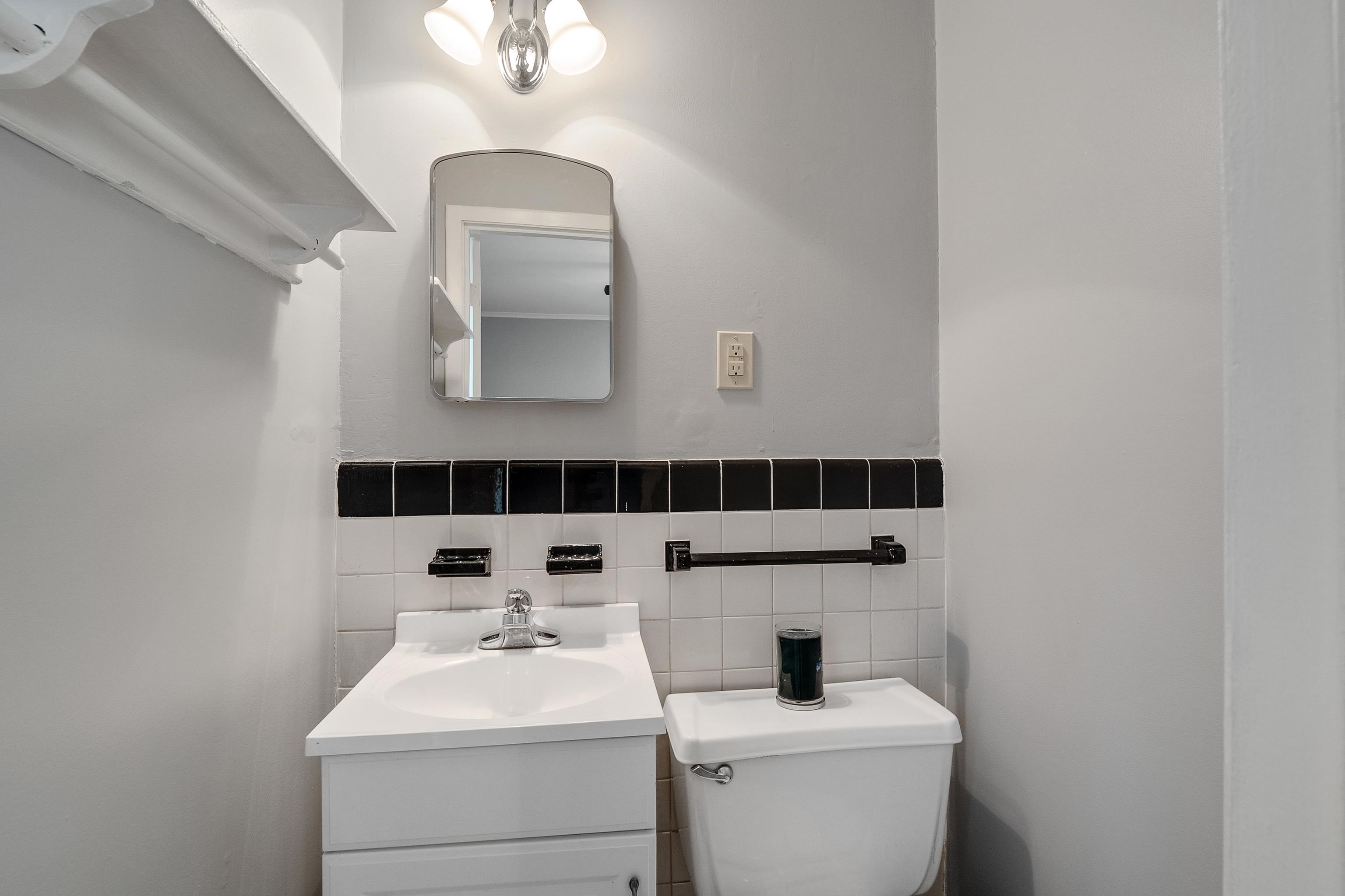 1551 Delmont Road Memphis, TN 38117 - Photo 21 of 25 a bathroom with a sink and a mirror