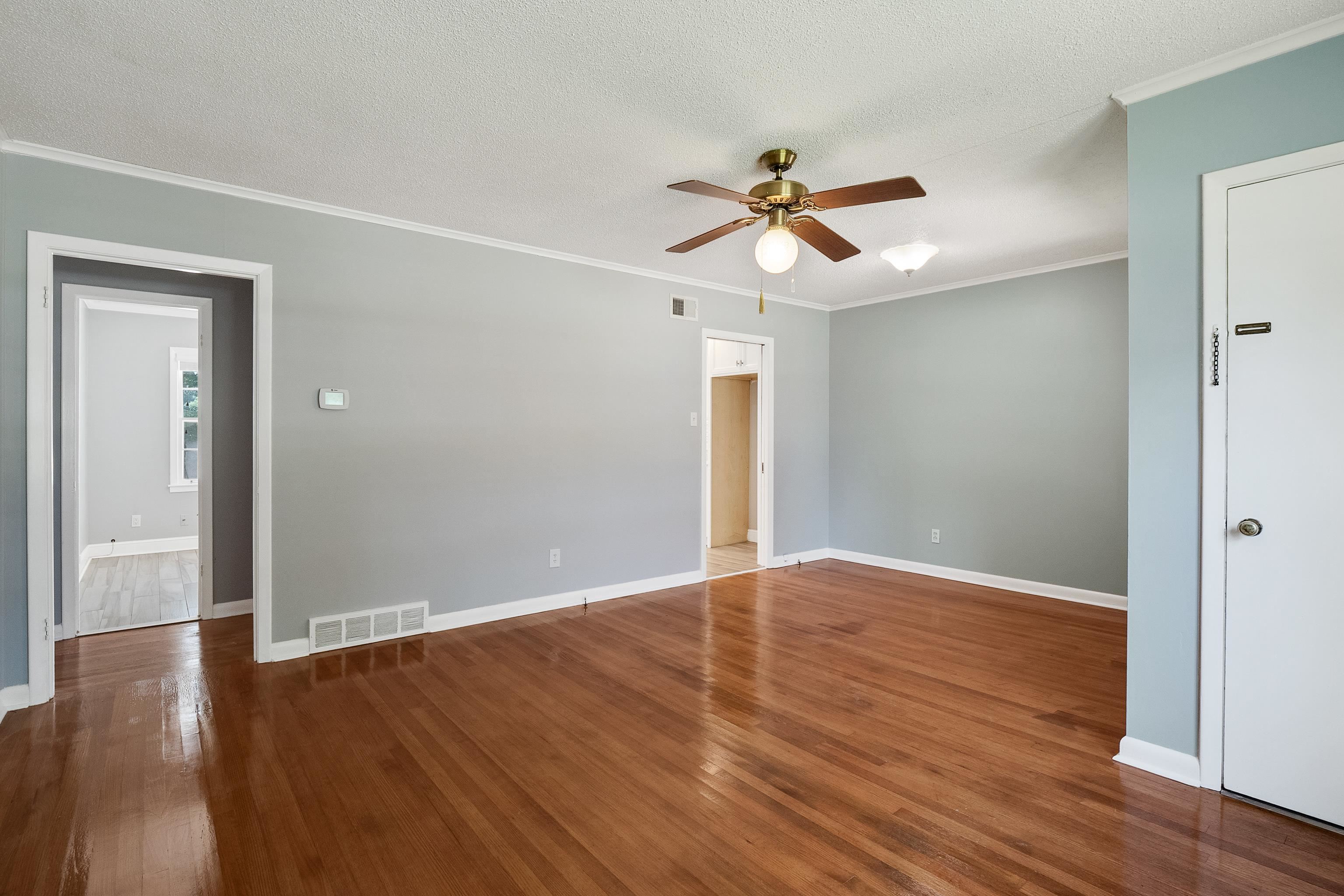 1551 Delmont Road Memphis, TN 38117 - Photo 3 of 25 a view of room with wooden floor and ceiling fan