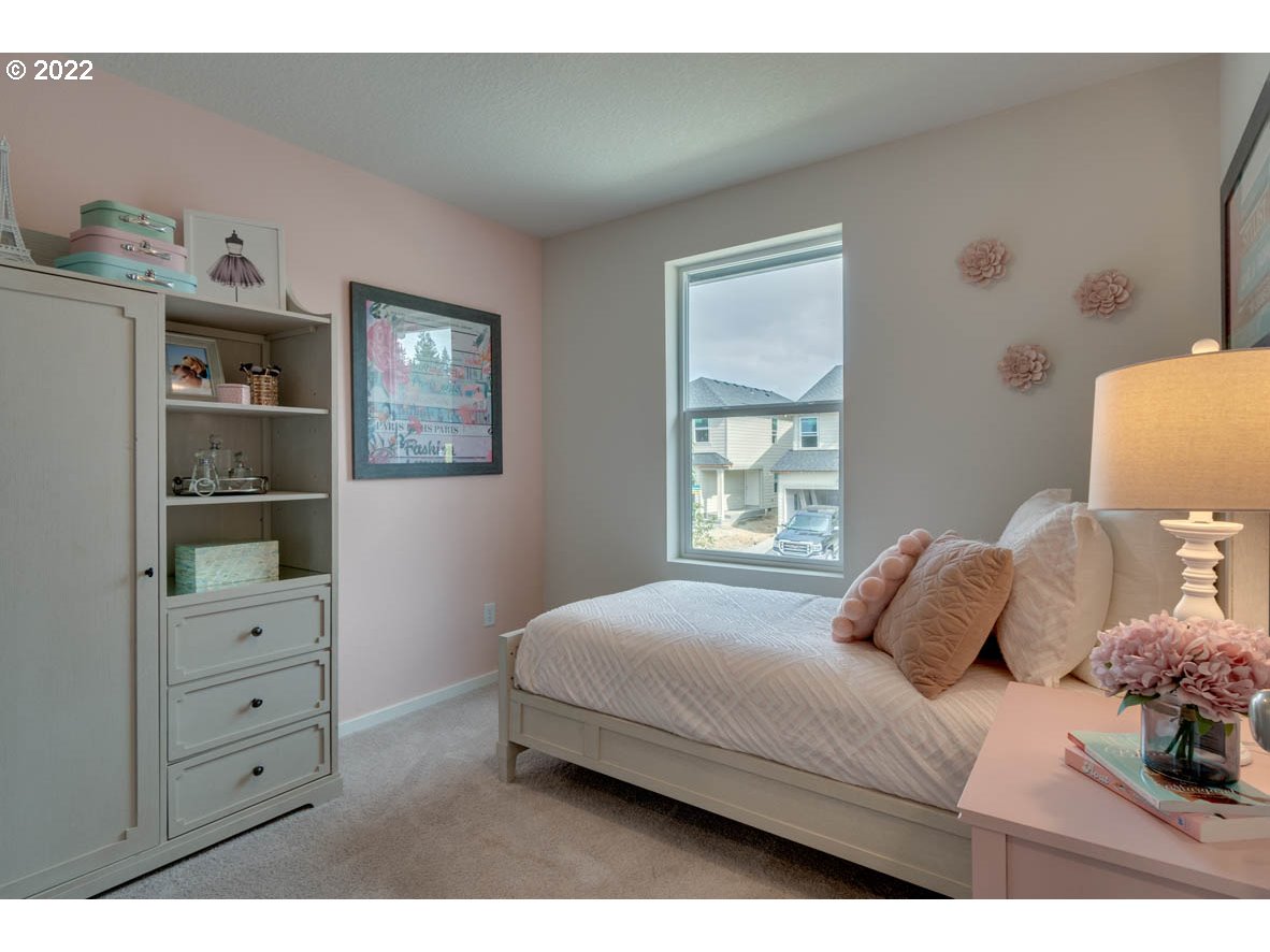 2914 North 3rd Way Ridgefield, WA 98642 - Photo 12 of 24 a bedroom with a bed window and wall painting