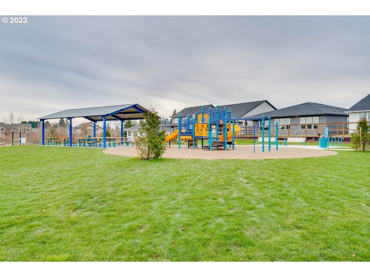 2914 North 3rd Way Ridgefield, WA 98642 - Photo 23 of 24 a outdoor space of a house with a garden and plants