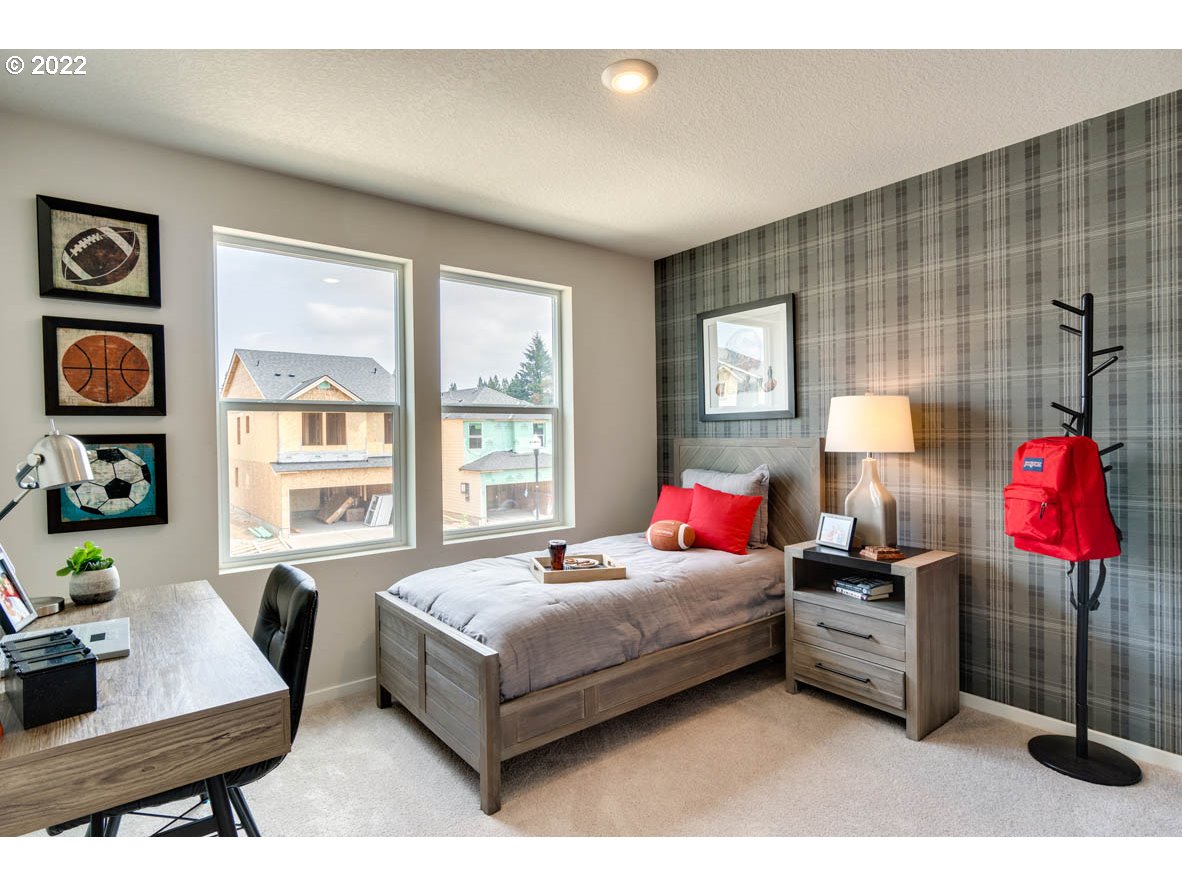 2914 North 3rd Way Ridgefield, WA 98642 - Photo 10 of 24 a living room with a bed furniture and a window
