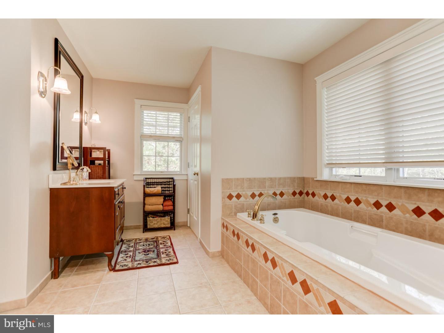 1710 Hickory Hill Road Chadds Ford, PA 19317 - Photo 14 of 25 a bathroom with a bathtub and a window