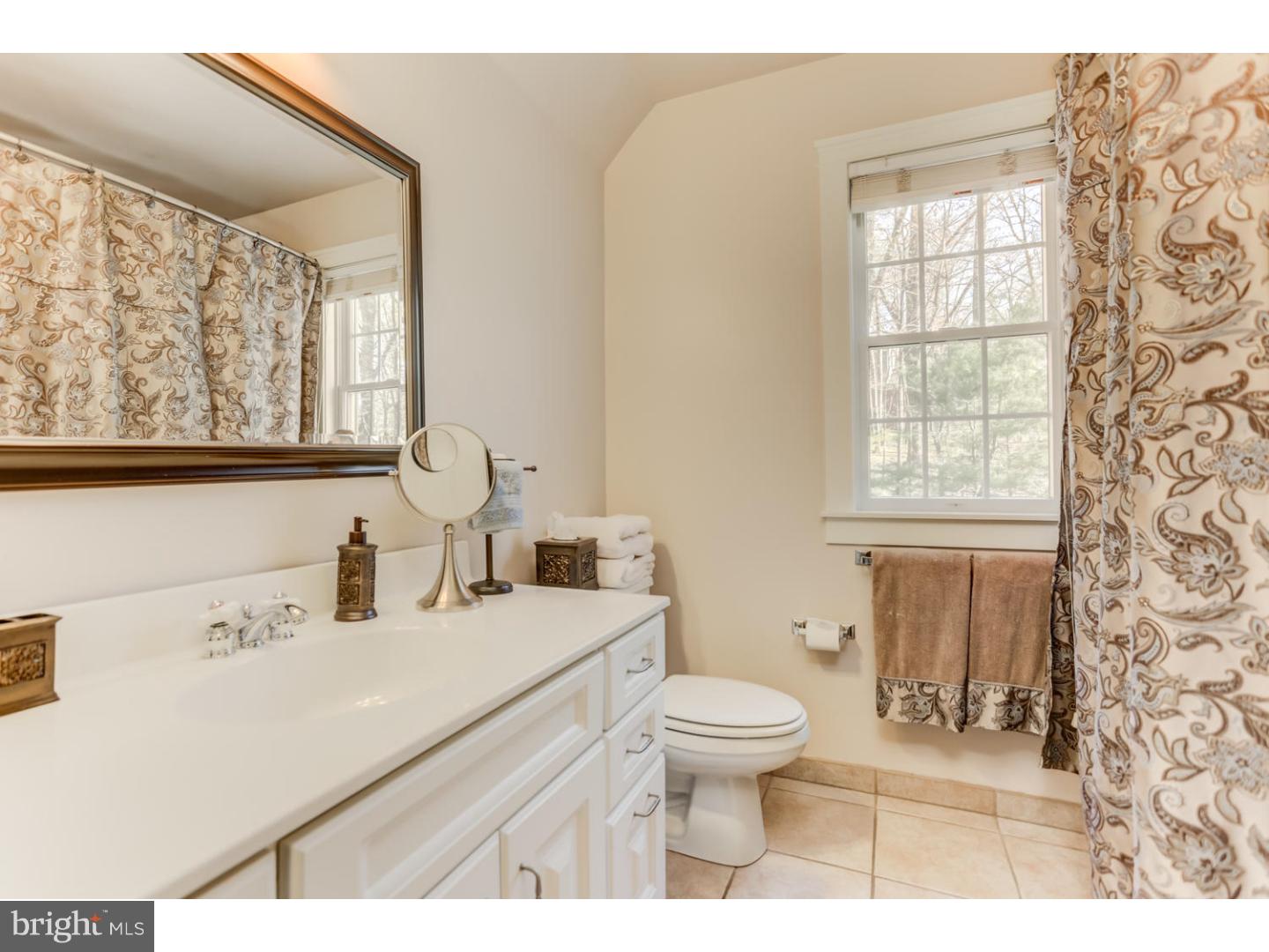 1710 Hickory Hill Road Chadds Ford, PA 19317 - Photo 20 of 25 a bathroom with a sink toilet and window