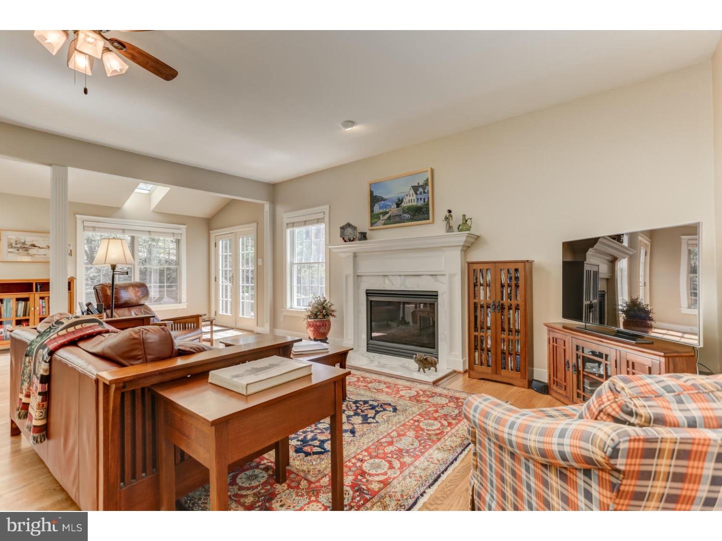 1710 Hickory Hill Road Chadds Ford, PA 19317 - Photo 9 of 25 a living room with furniture a flat screen tv and a fireplace