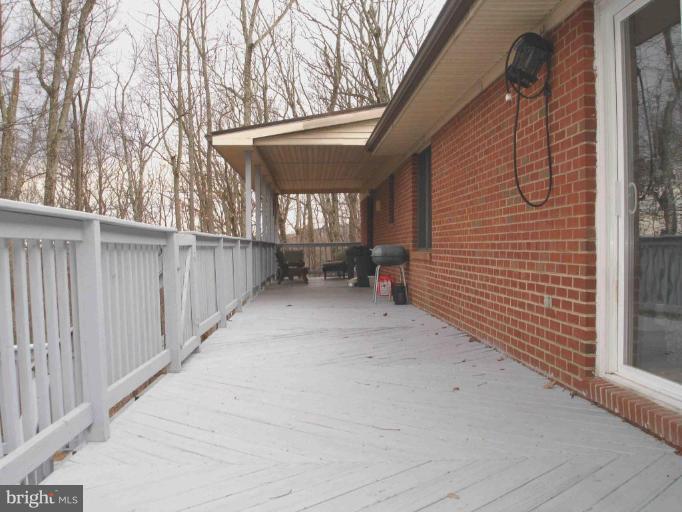 400 Aaron Mountain Road Castleton, VA 22716 - Photo 3 of 9 Across back of the house; cement patio walkout