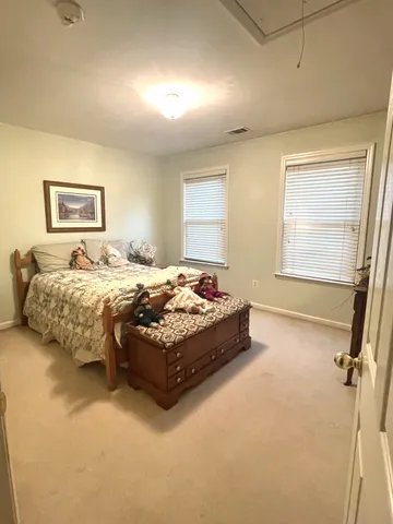 a bathroom with a granite countertop sink a large mirror and a shower