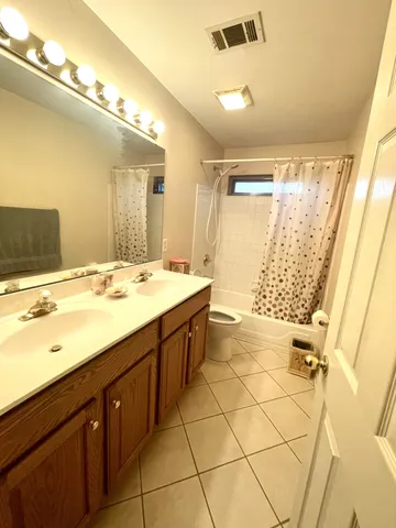 a room with gym equipment and a flat screen tv