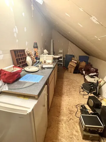 a view of balcony with wooden floor and outdoor seating