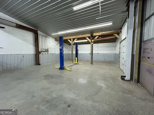 a view of empty room with wooden walls