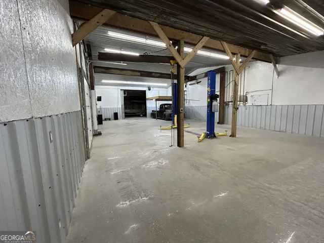 a view of empty room with wooden ceiling