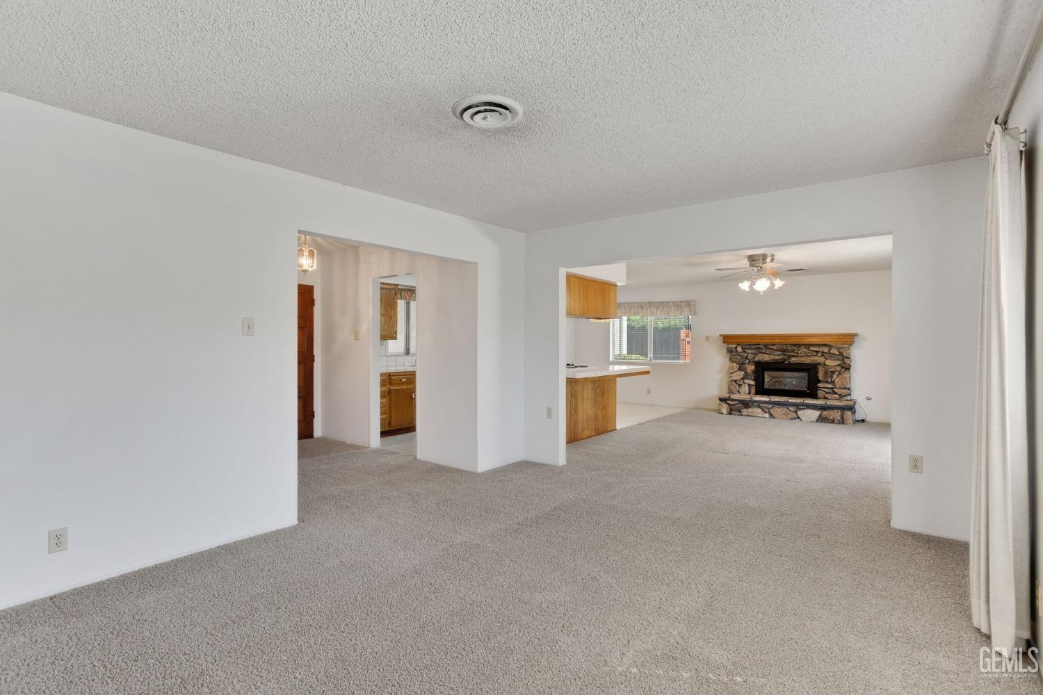 Undisclosed Address Bakersfield, CA 93309 - Photo 11 of 43 a living room with furniture and a fireplace