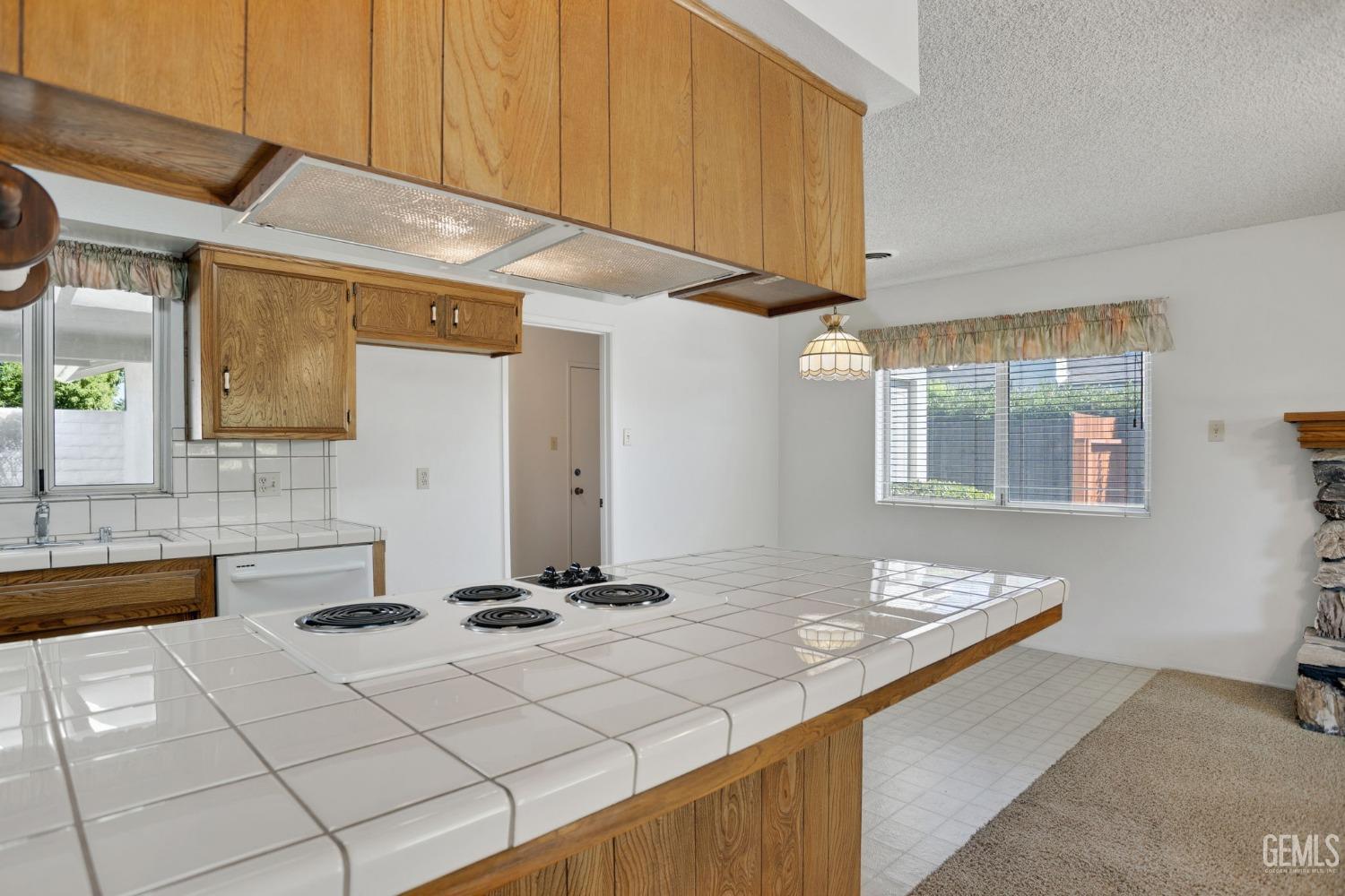 Undisclosed Address Bakersfield, CA 93309 - Photo 16 of 43 a kitchen with a sink cabinets and window