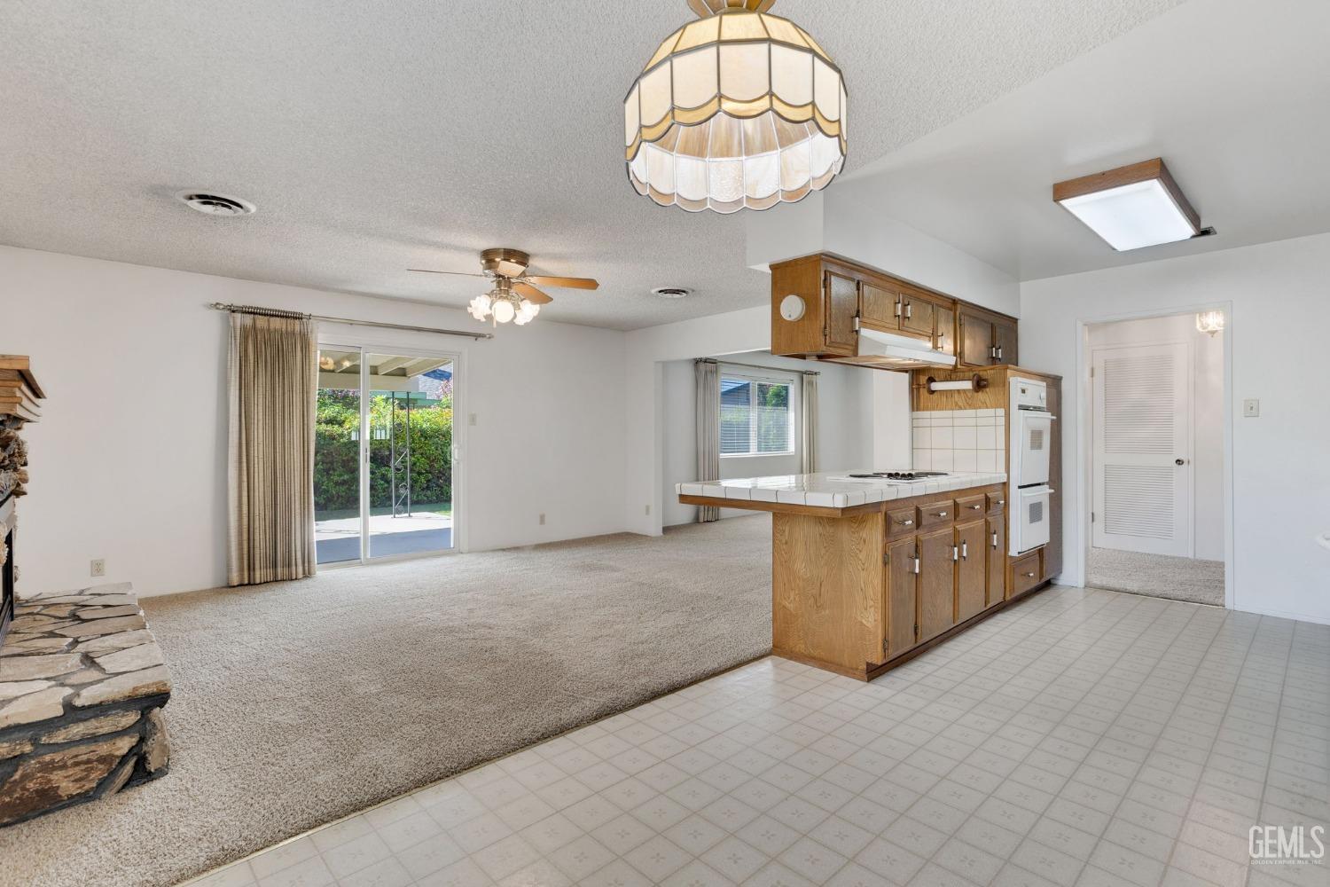 Undisclosed Address Bakersfield, CA 93309 - Photo 17 of 43 a large kitchen with a large window a counter space and stainless steel appliances