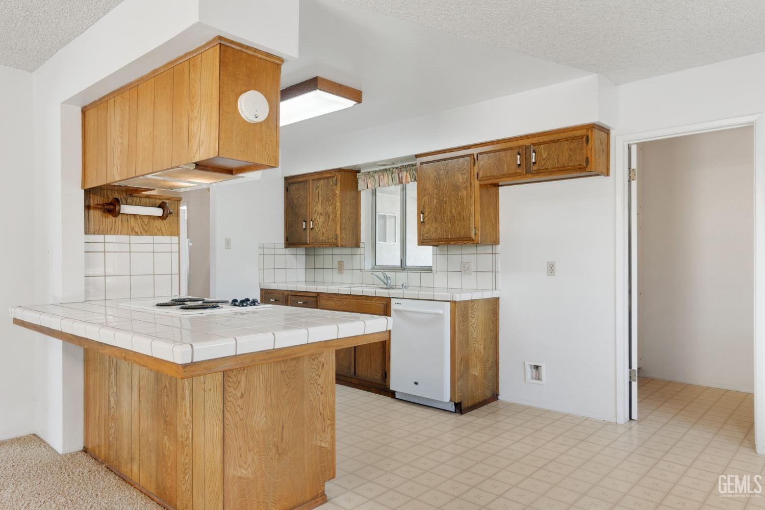Undisclosed Address Bakersfield, CA 93309 - Photo 19 of 43 a kitchen with stainless steel appliances granite countertop a sink and a refrigerator