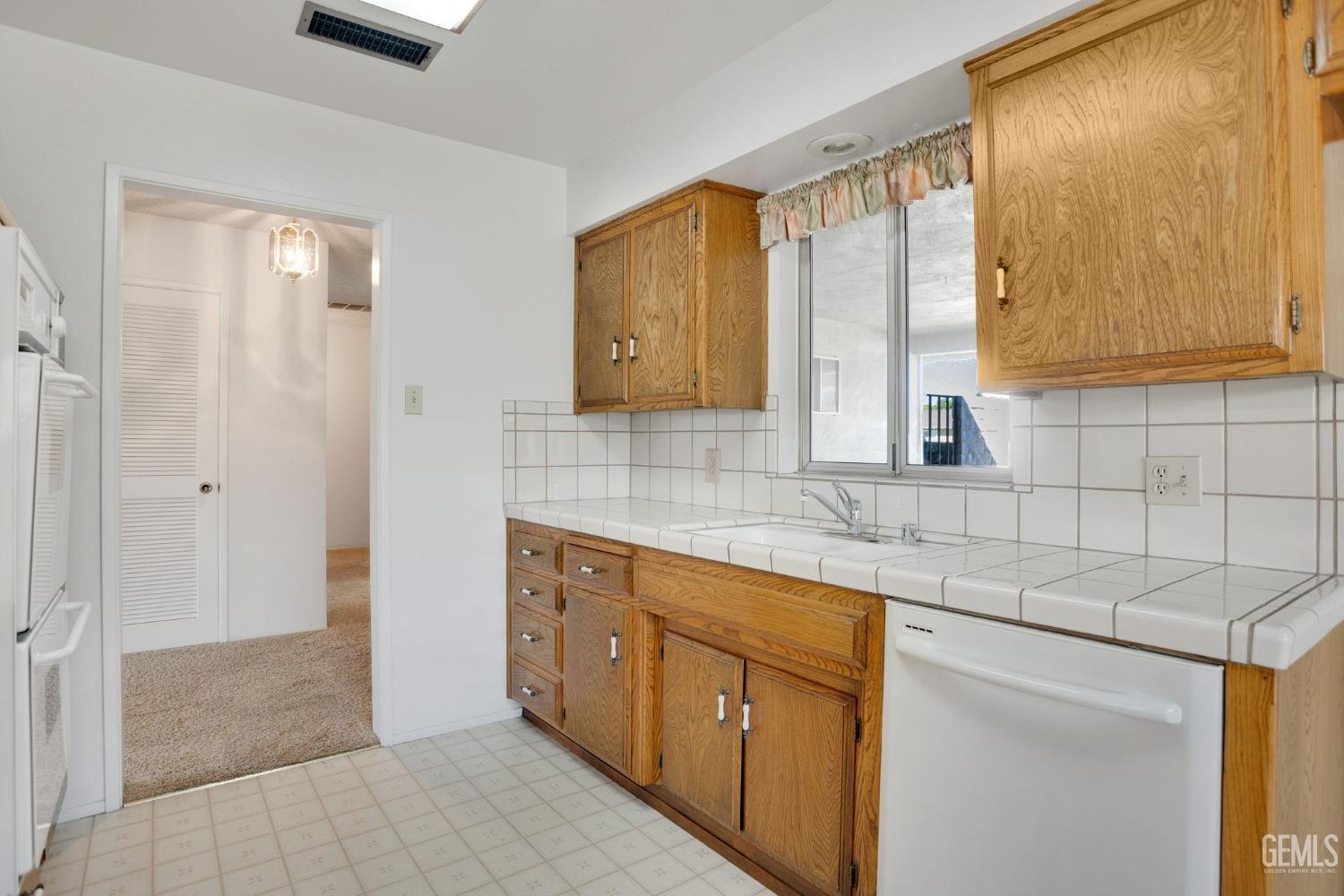 Undisclosed Address Bakersfield, CA 93309 - Photo 21 of 43 a bathroom with a sink and a mirror