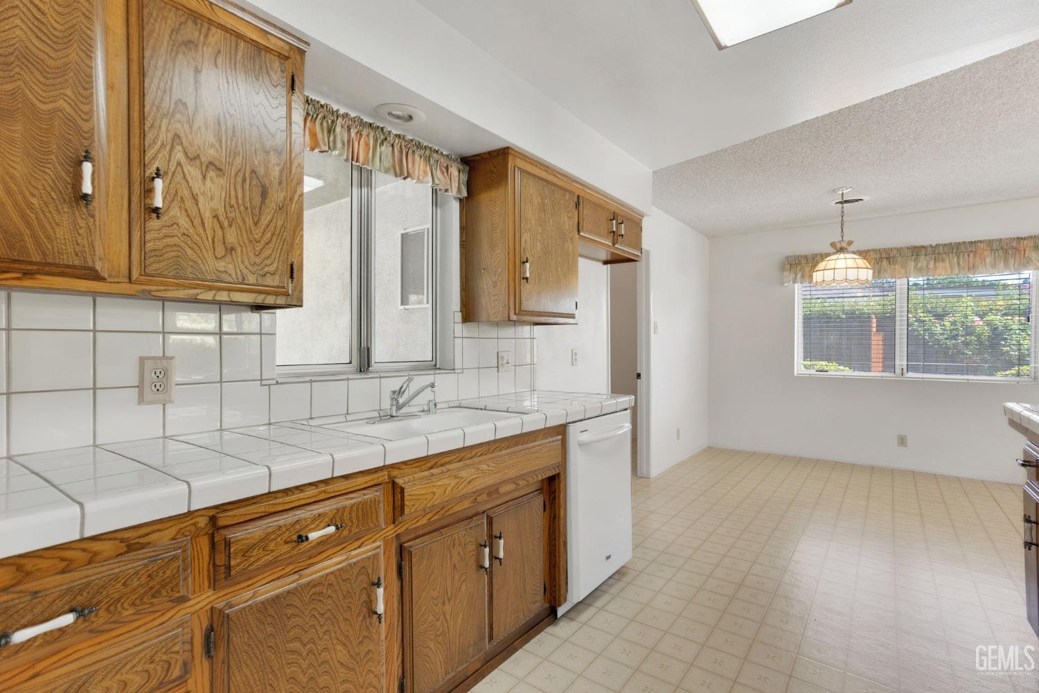 Undisclosed Address Bakersfield, CA 93309 - Photo 22 of 43 a kitchen with a sink cabinets and window