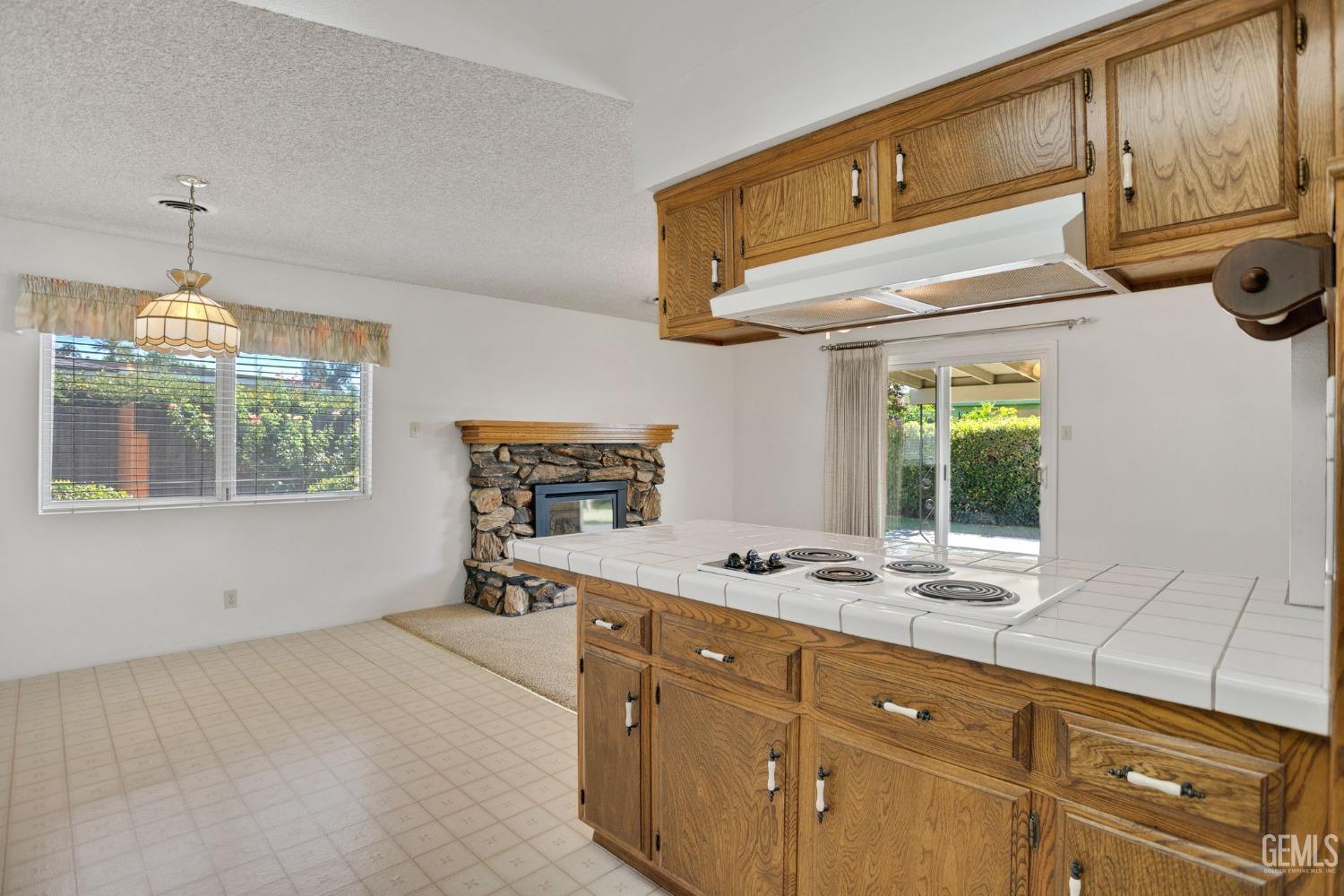 Undisclosed Address Bakersfield, CA 93309 - Photo 23 of 43 a kitchen with a stove a sink and a window