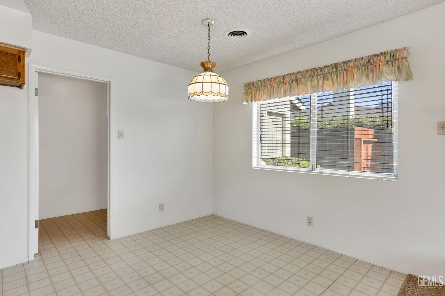 Undisclosed Address Bakersfield, CA 93309 - Photo 24 of 43 a view of an empty room with a window