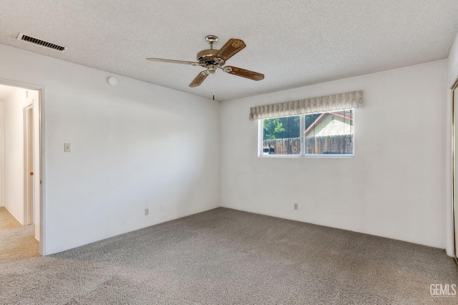 Undisclosed Address Bakersfield, CA 93309 - Photo 26 of 43 a view of an empty room with a window
