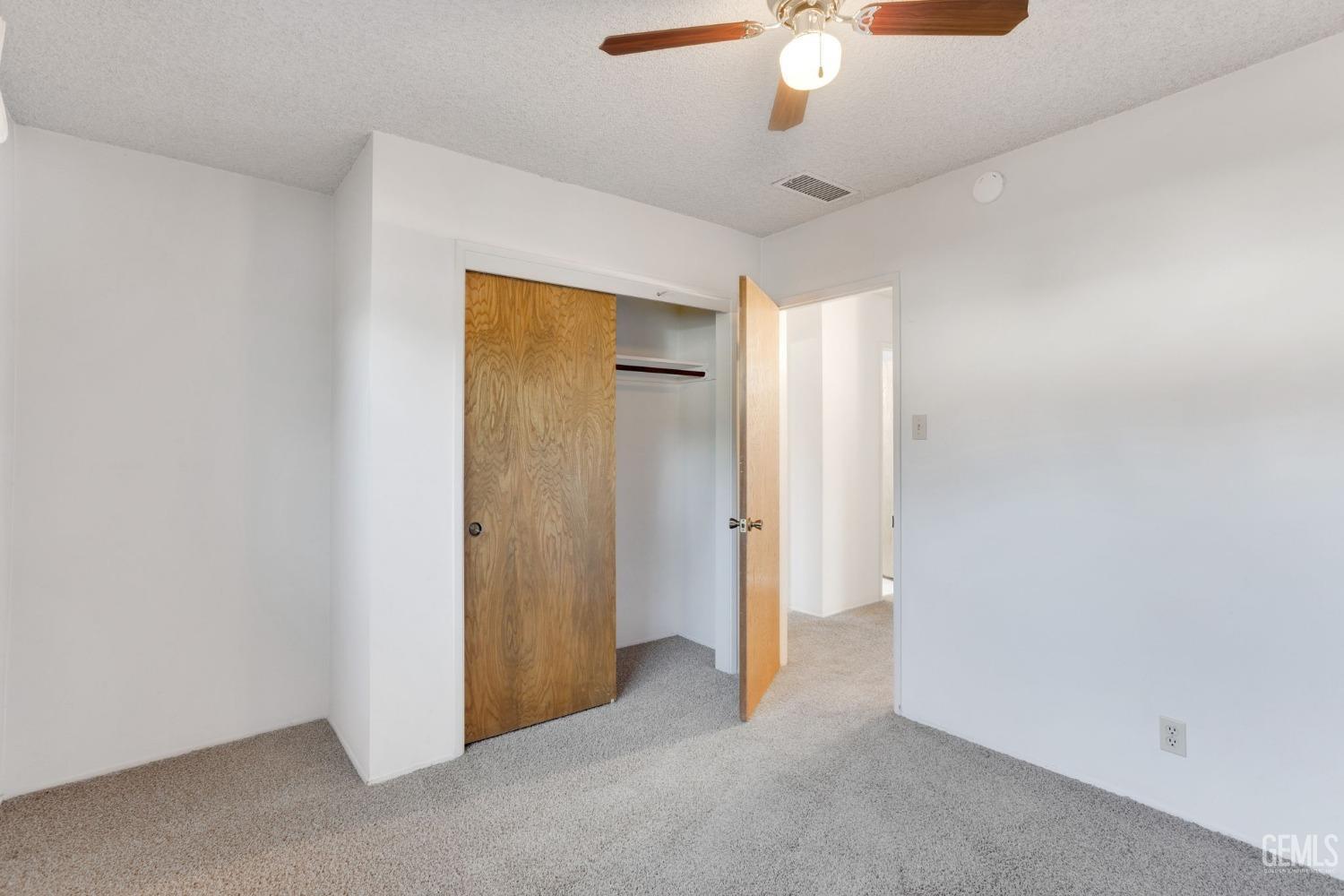 Undisclosed Address Bakersfield, CA 93309 - Photo 33 of 43 a view of a room with a ceiling fan