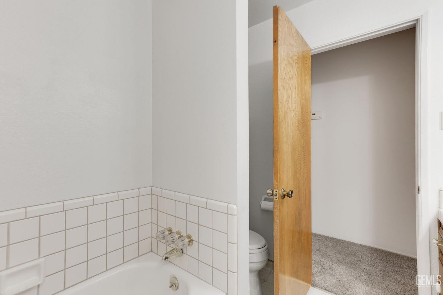 Undisclosed Address Bakersfield, CA 93309 - Photo 35 of 43 a bathroom with a bathtub