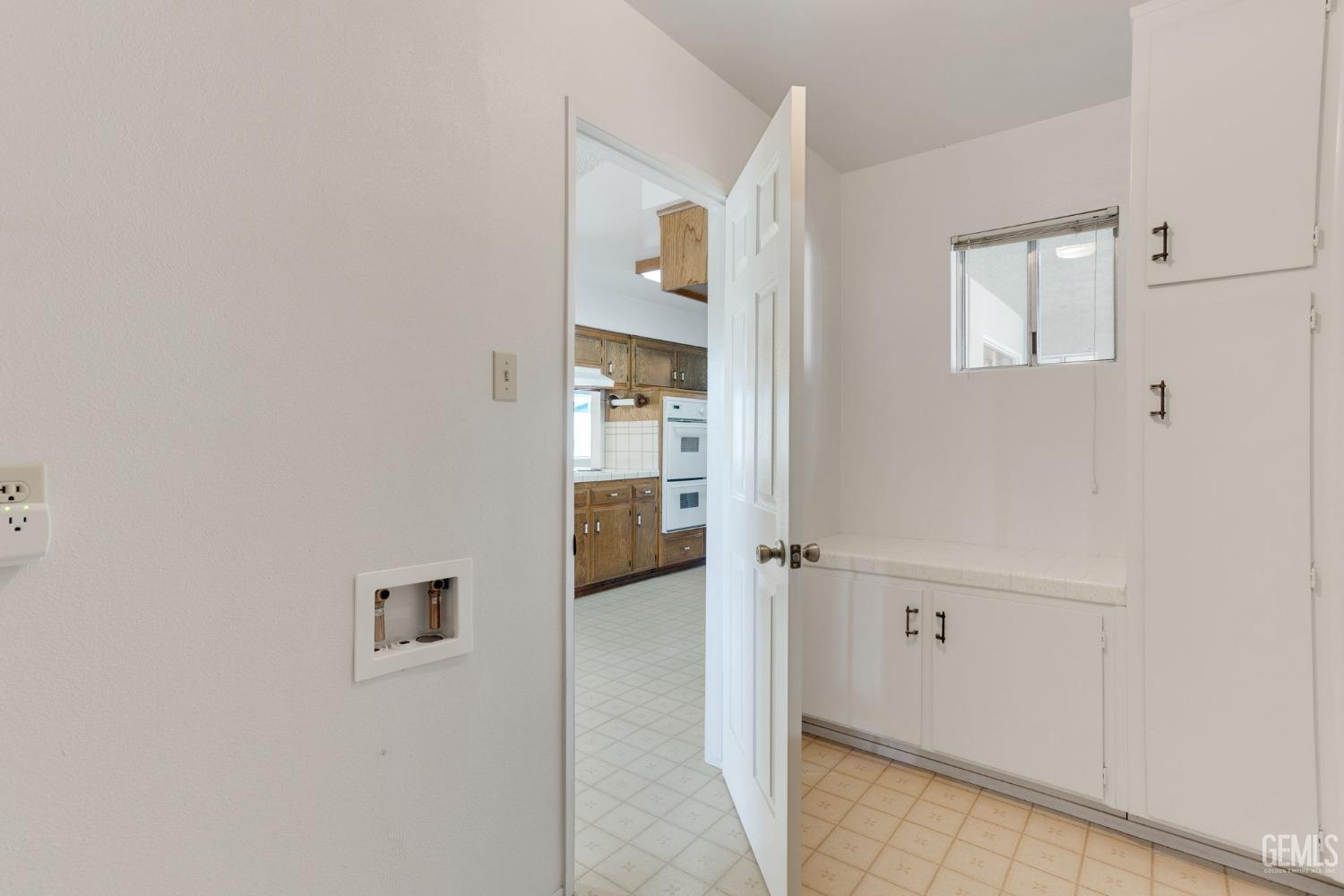 Undisclosed Address Bakersfield, CA 93309 - Photo 38 of 43 a view of a hallway with wooden shelves