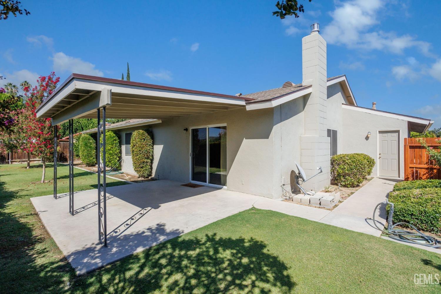 Undisclosed Address Bakersfield, CA 93309 - Photo 40 of 43 a view of a house with backyard