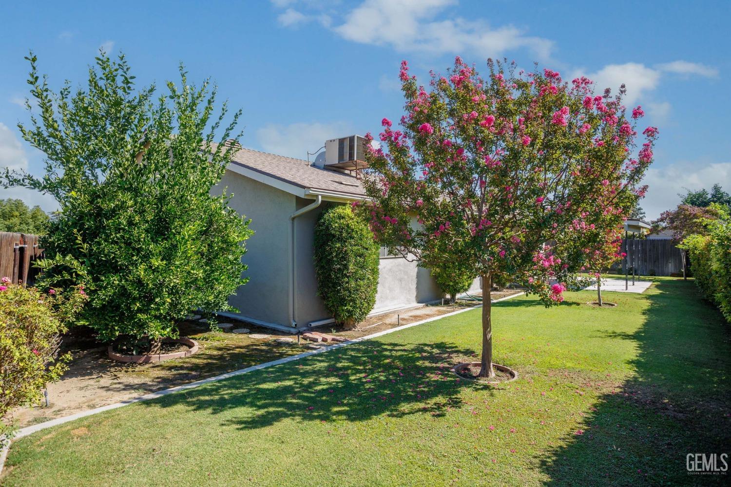 Undisclosed Address Bakersfield, CA 93309 - Photo 42 of 43 a front view of a house with a yard