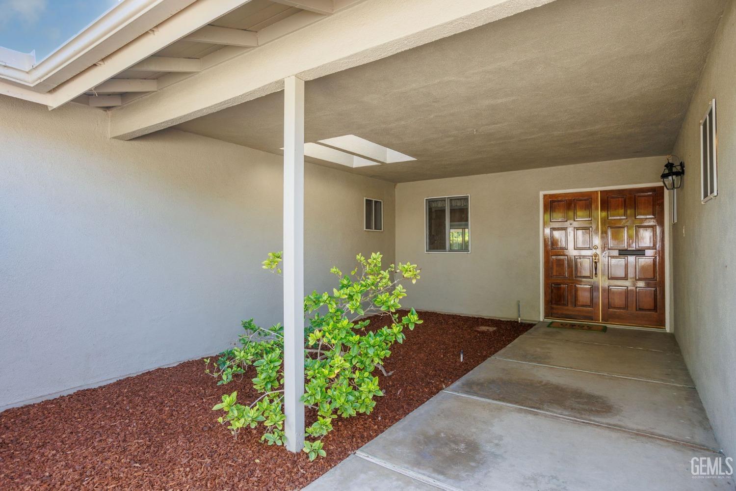 Undisclosed Address Bakersfield, CA 93309 - Photo 5 of 43 a front view of a house with a yard