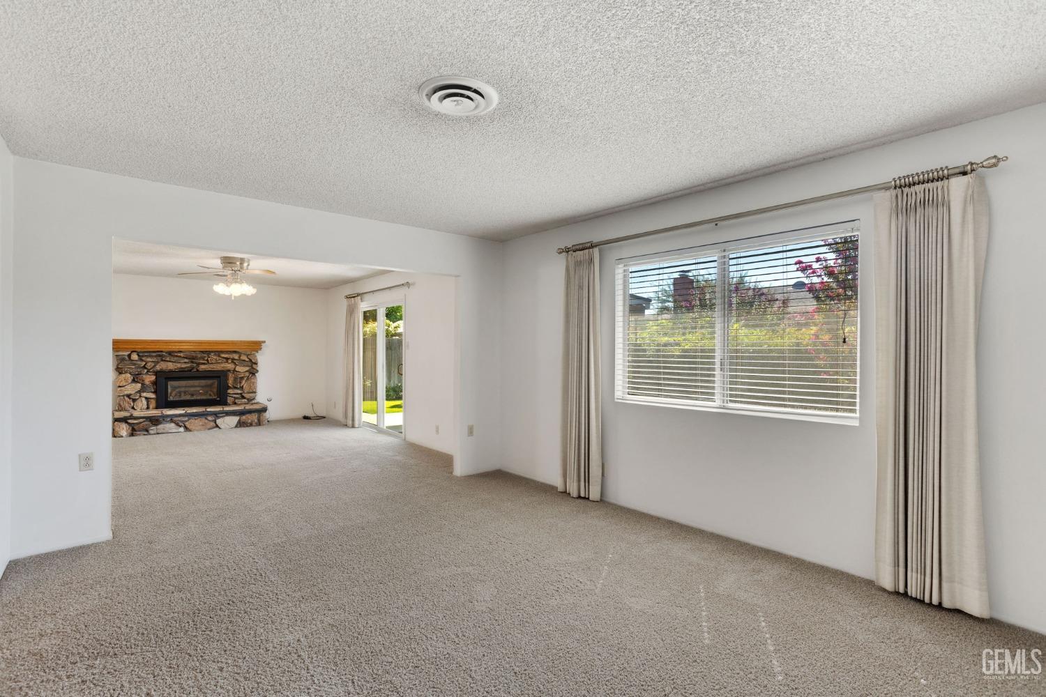 Undisclosed Address Bakersfield, CA 93309 - Photo 9 of 43 a view of an empty room with a window
