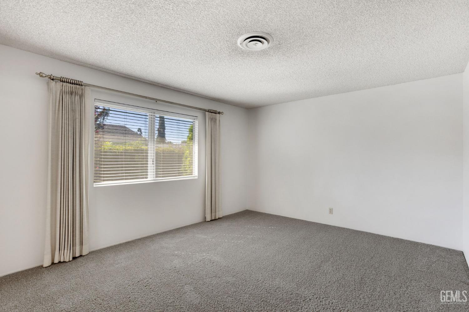 Undisclosed Address Bakersfield, CA 93309 - Photo 10 of 43 an empty room with a window
